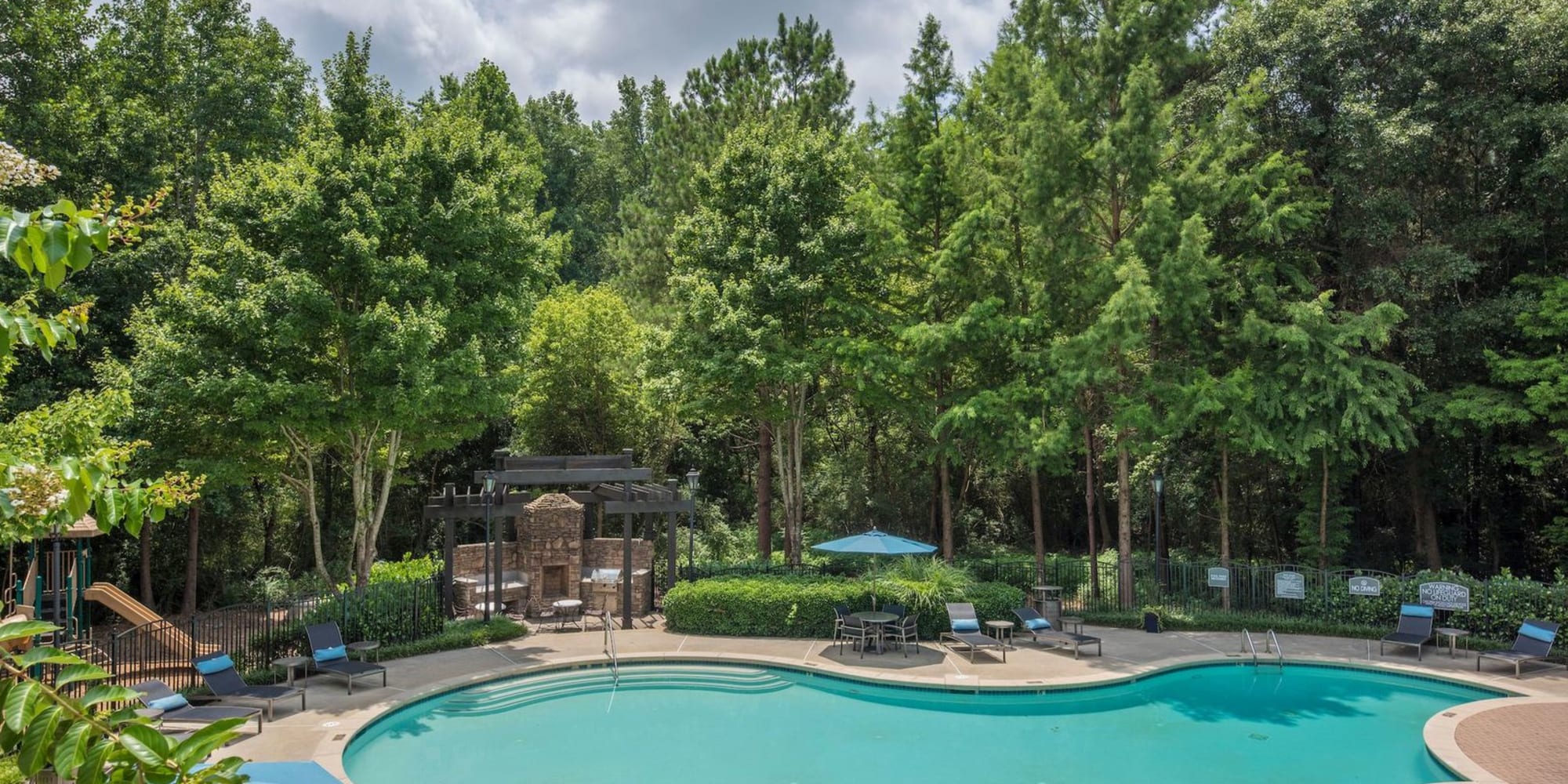Pool with trees at Fieldstone Glen in Jonesboro, Georgia