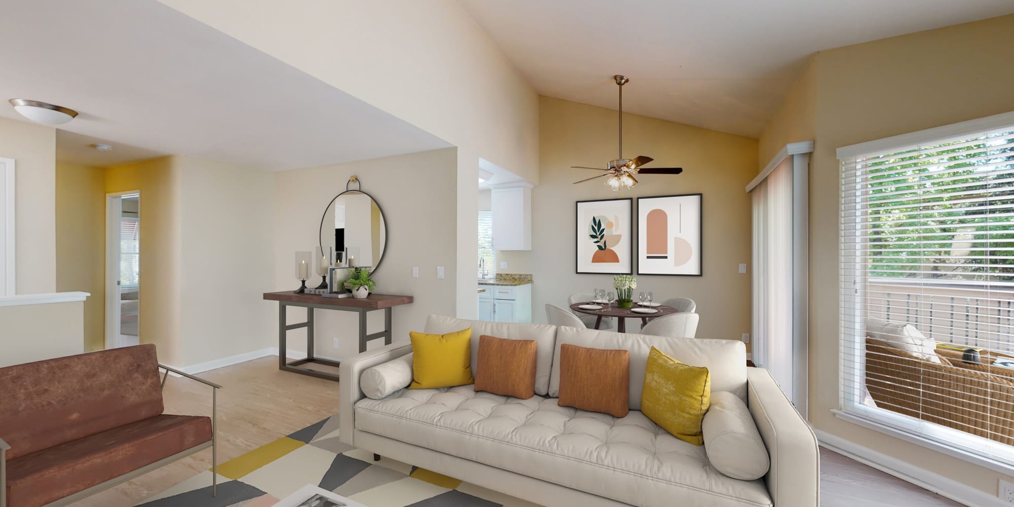 Two-bedroom apartment's living area with bay windows and plank flooring at Valley Plaza Villages in Pleasanton, California
