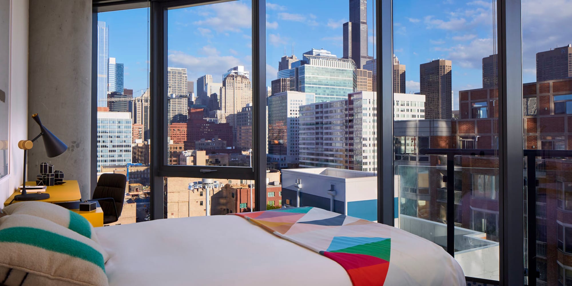 Floor to ceiling windows in the bedroom at The Parker Fulton Market in Chicago, Illinois