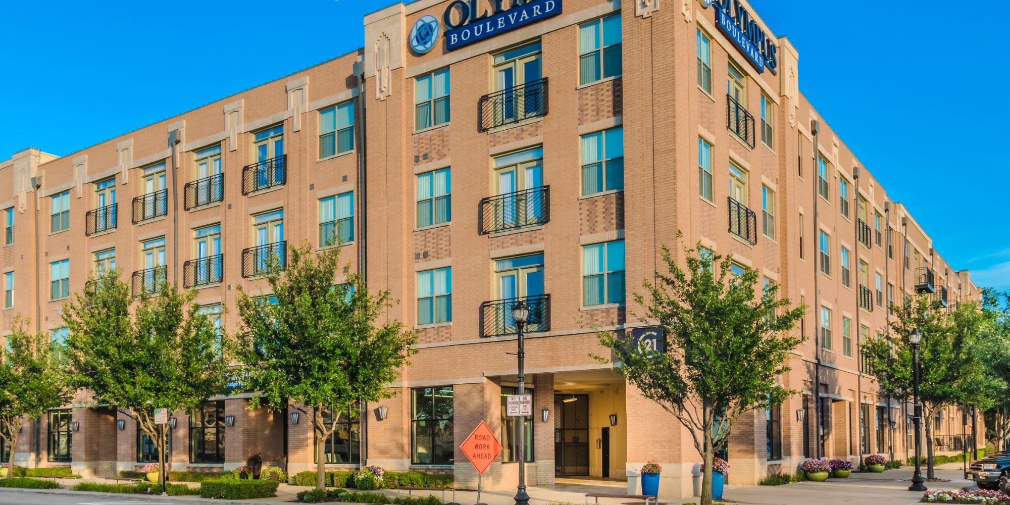Exterior view of the apartment complex at Olympus Boulevard in Frisco, Texas