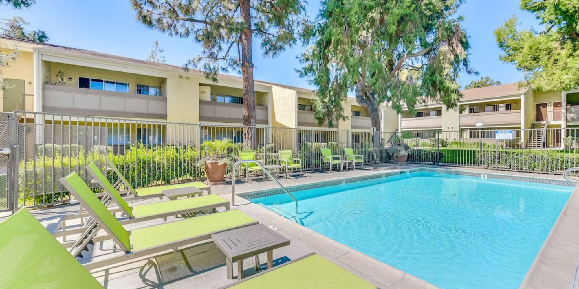 Luxurious swimming pool and outdoor amenities at Torrey Pines Apartment Homes in West Covina, California