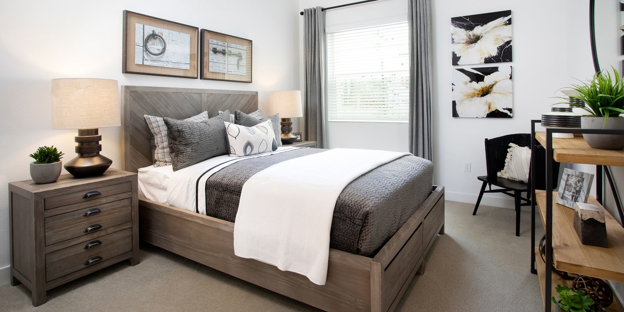 Model bedroom with dark accents at The Residences at Escaya in Chula Vista, California