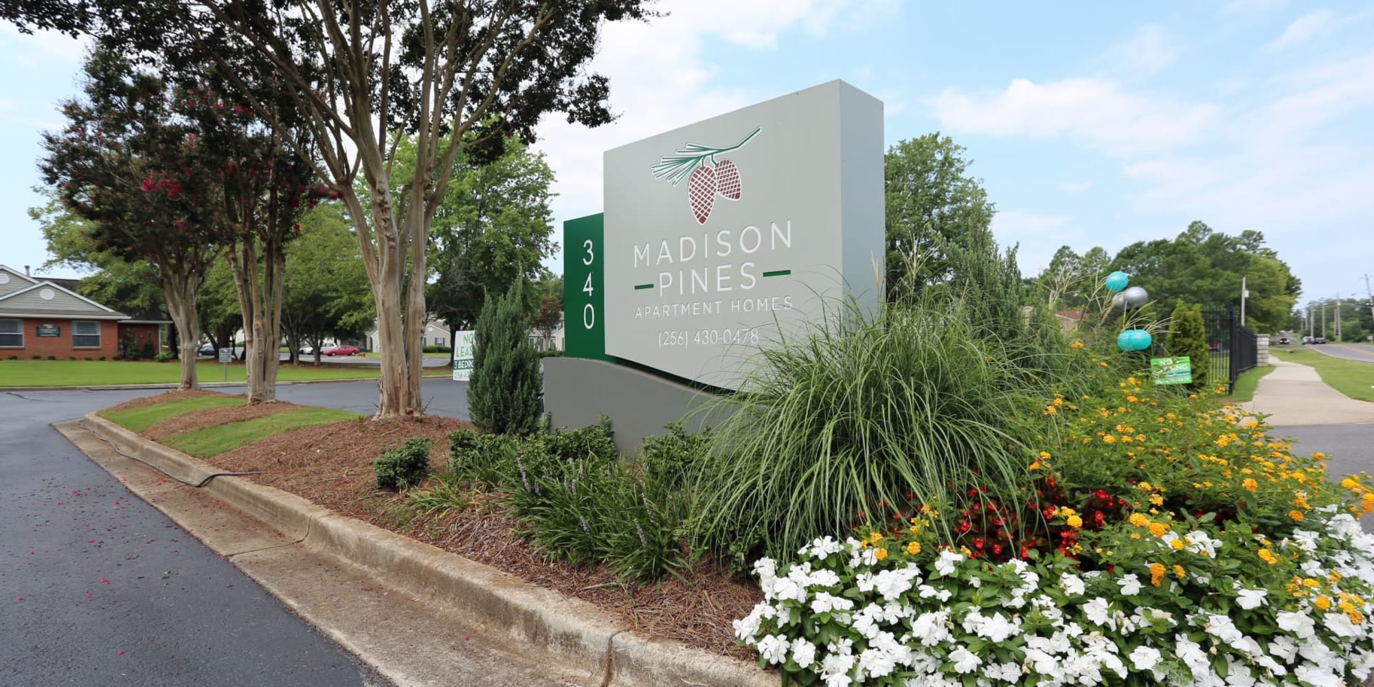 Welcome sign at Madison Pines Apartment Homes in Madison, Alabama