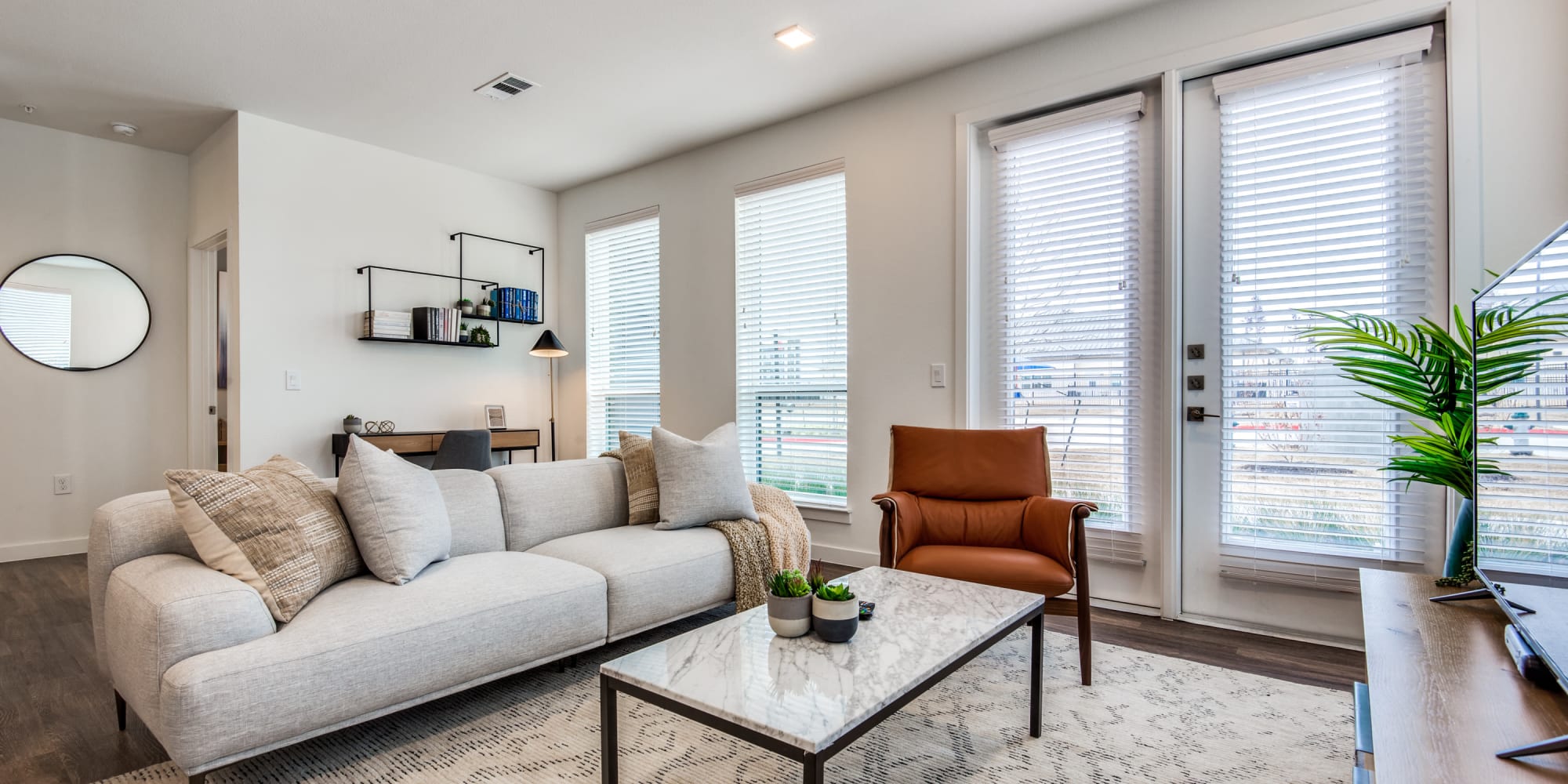 Model living space with great views at Mezzo Apartments in Aubrey, Texas
