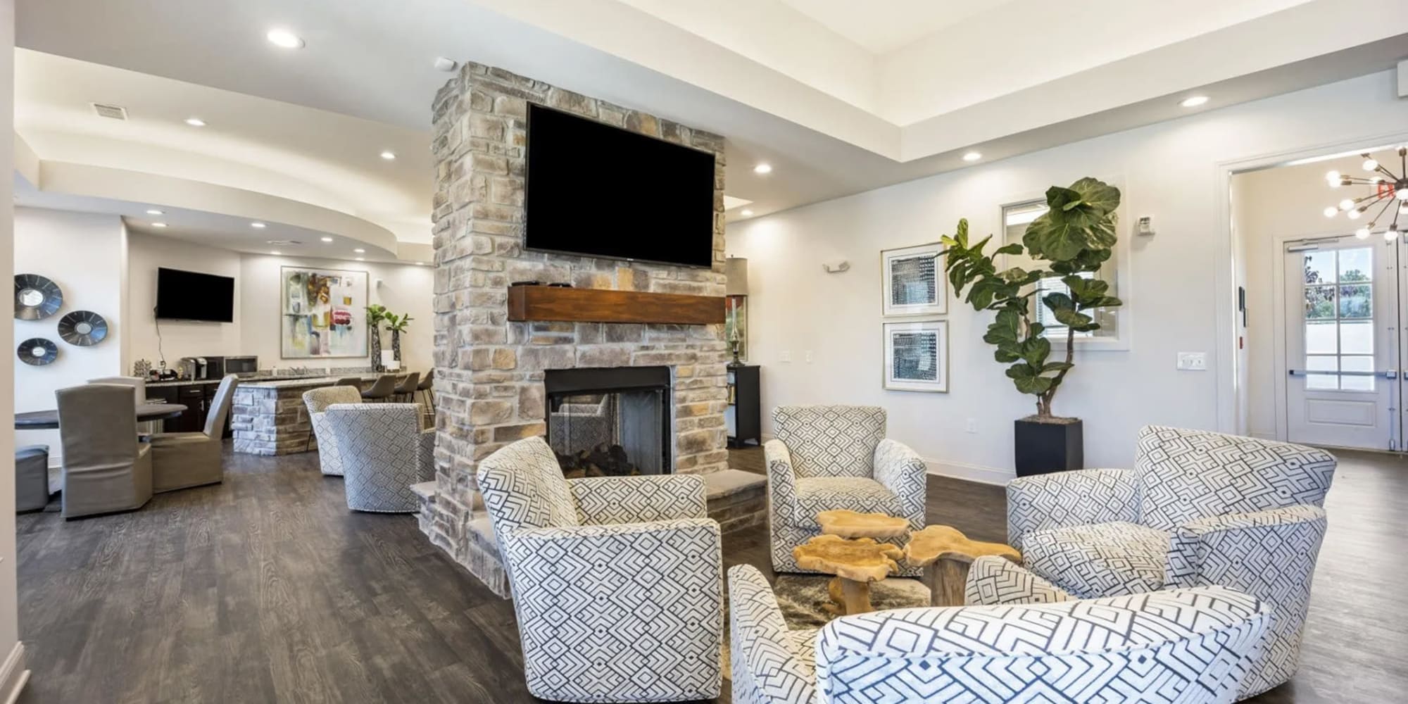 Relax and lounge by the fireplace in our clubhouse at The Maddox in Centerton, Arkansas