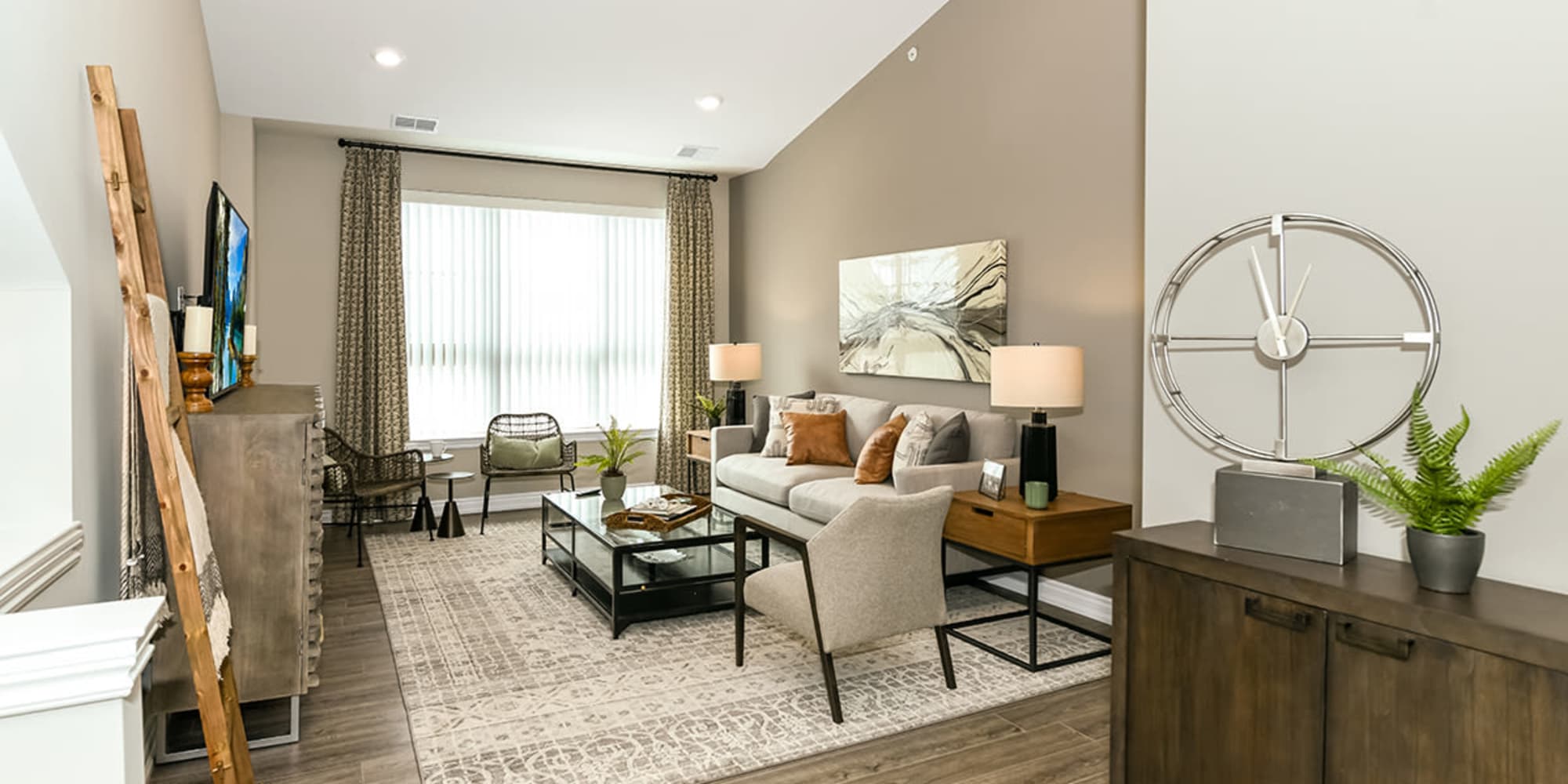 Beautiful living room with natural light at Encore at Manchester in Novi, Michigan