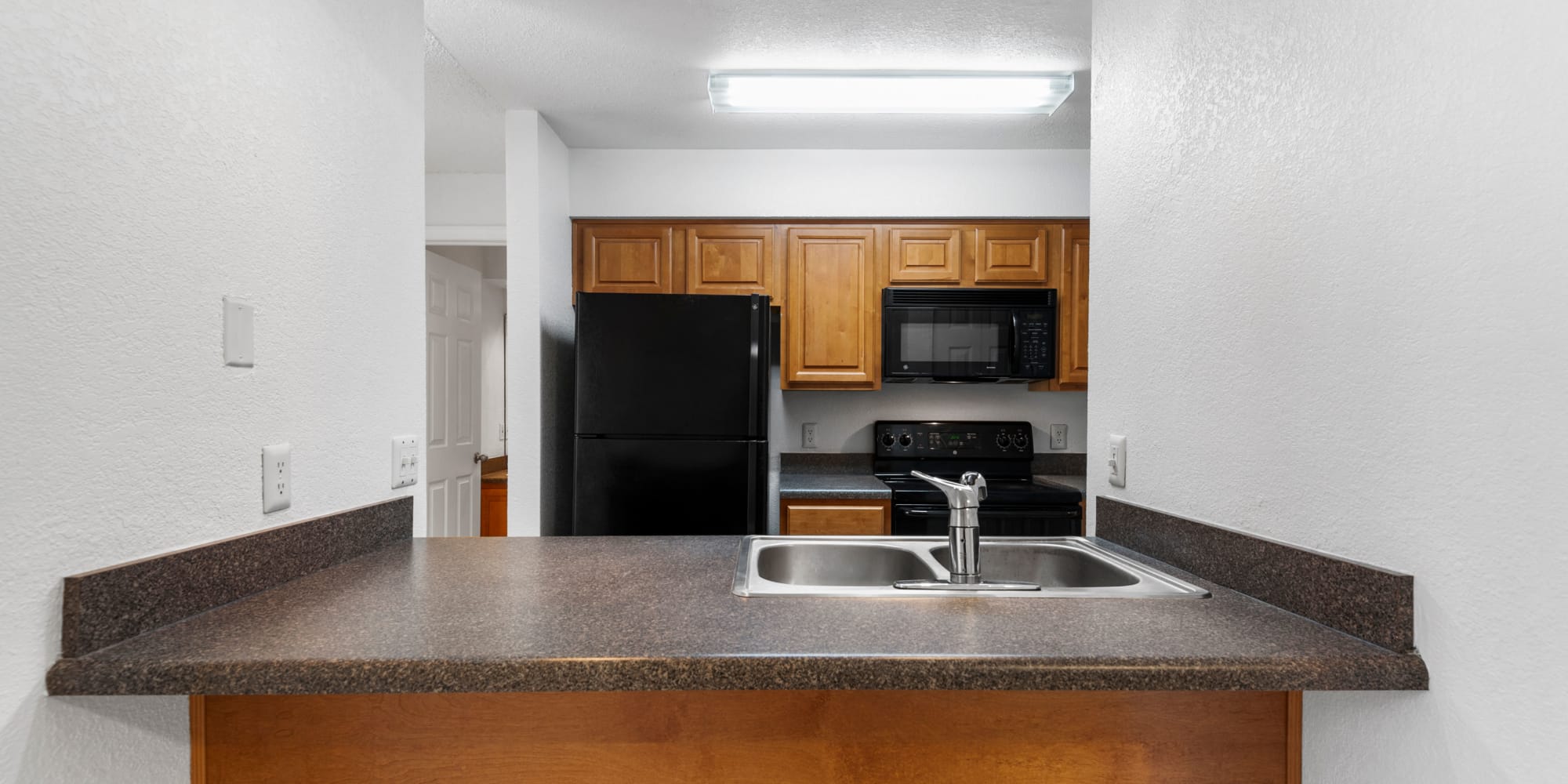 Kitchen with granite countertops at Stone Creek at Wekiva in Altamonte Springs, Florida