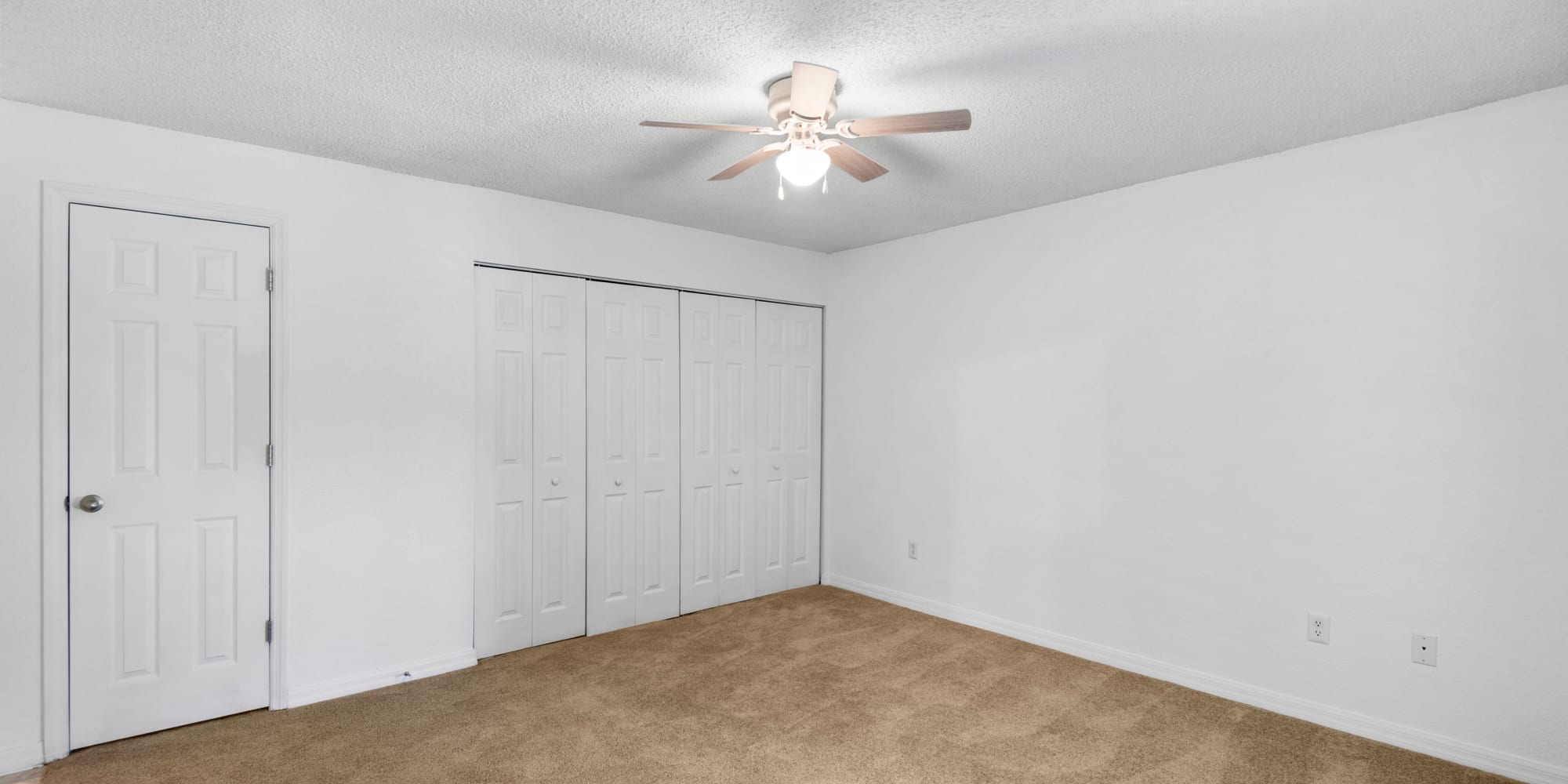 Bedroom with ceiling fan at Stone Creek at Wekiva in Altamonte Springs, Florida