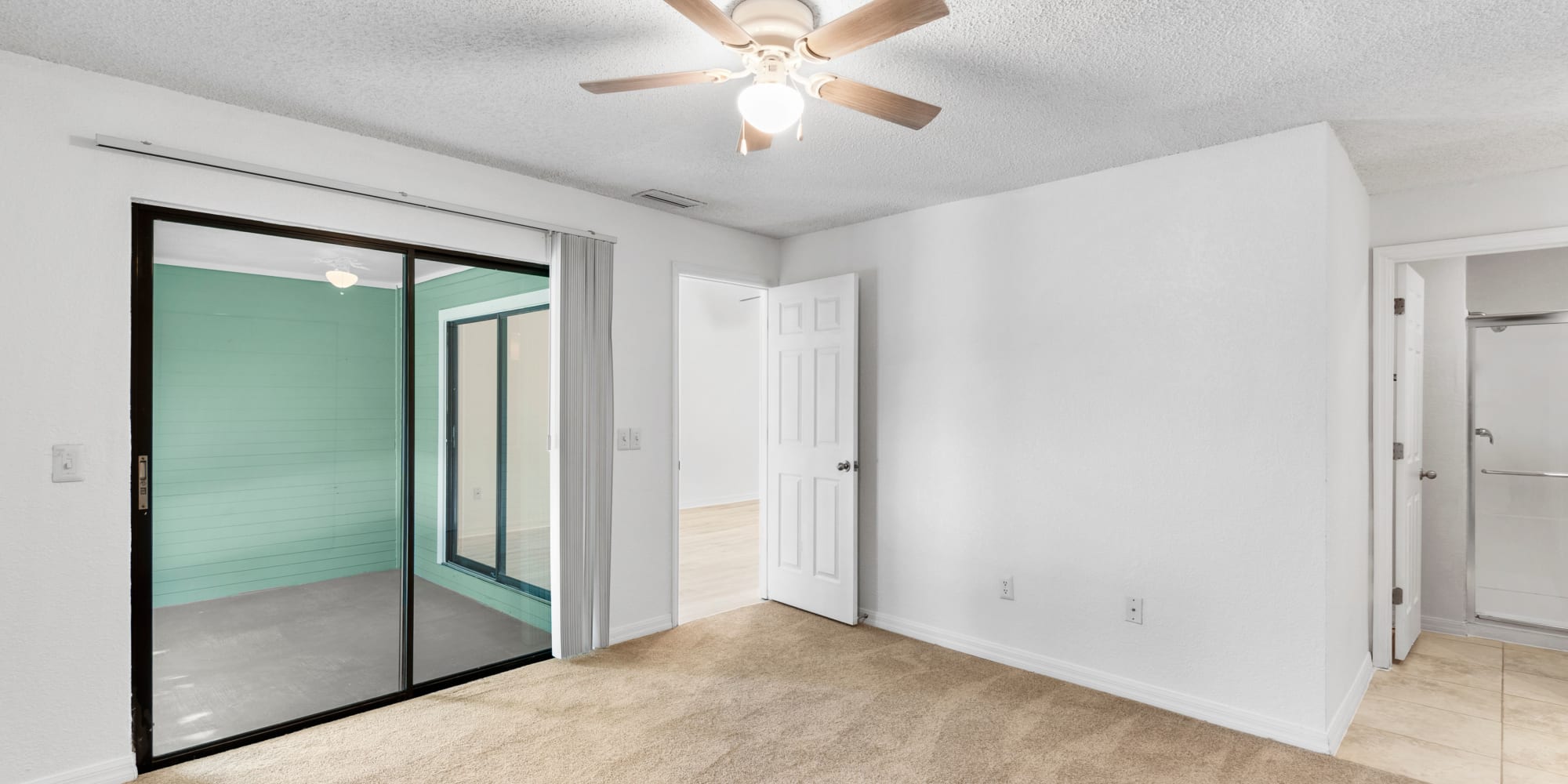 Apartment with doors to patio at Stone Creek at Wekiva in Altamonte Springs, Florida