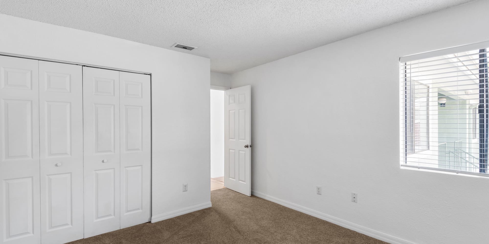 Bedroom with large closet at Stone Creek at Wekiva in Altamonte Springs, Florida