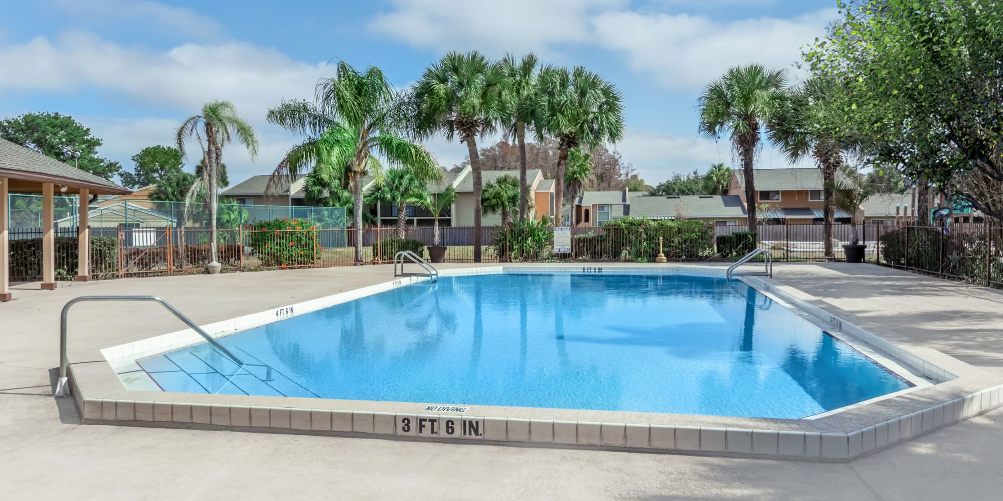 Swimming pool with large sun deck at The Cascades at Kissimmee in Kissimmee, Florida