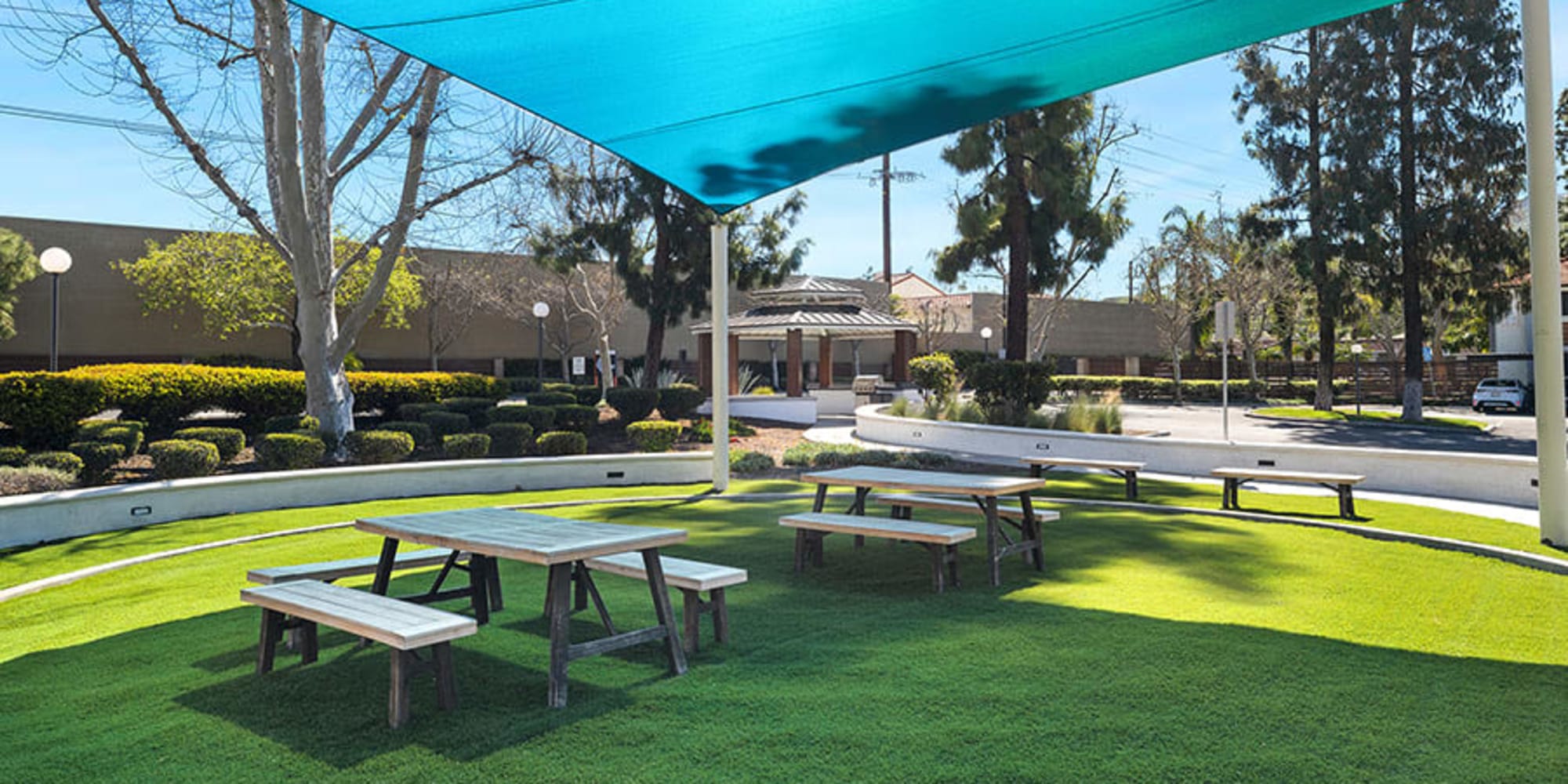 Lawn with picnic tables at Trails at Grand Terrace in Colton, California