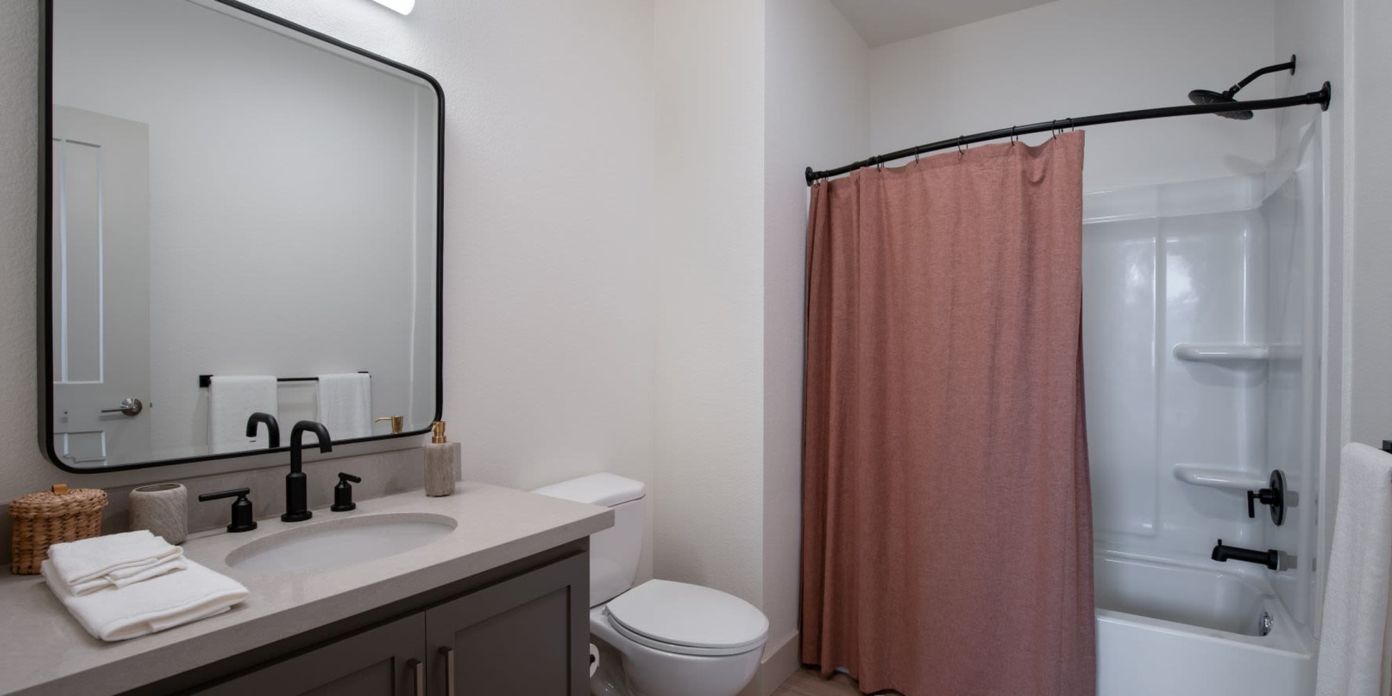 Bathroom with tub at Towne Centre Apartments in Lathrop, California