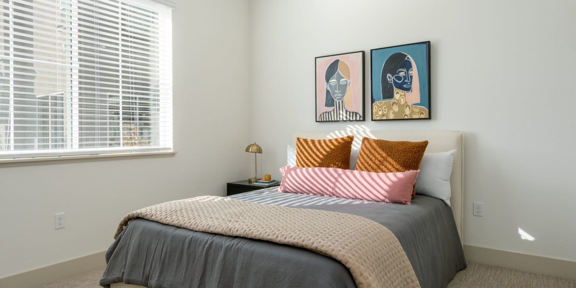 Bedroom with large window at Towne Centre Apartments in Lathrop, California
