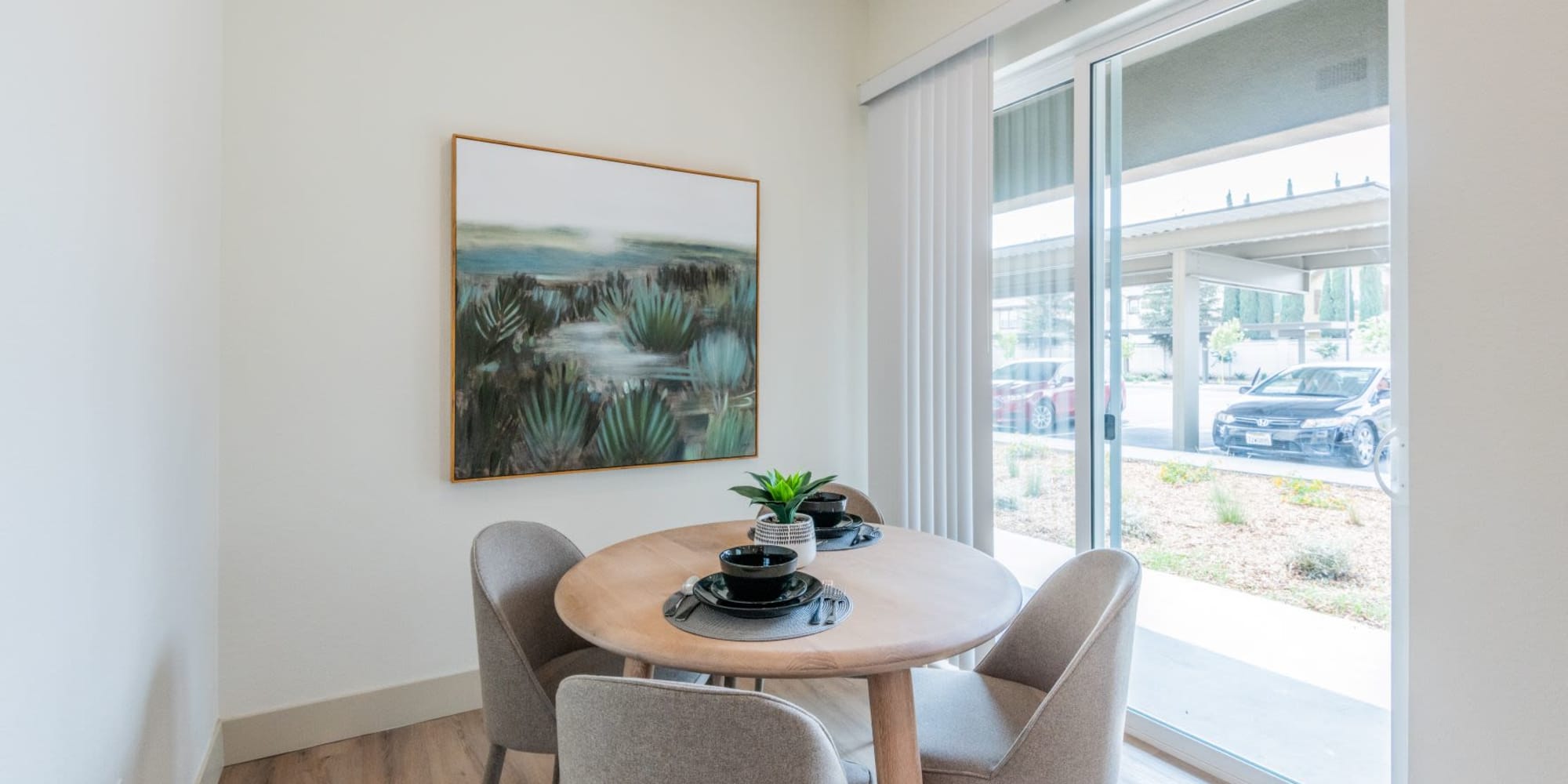 Dining corner with doors to patio at Towne Centre Apartments in Lathrop, California