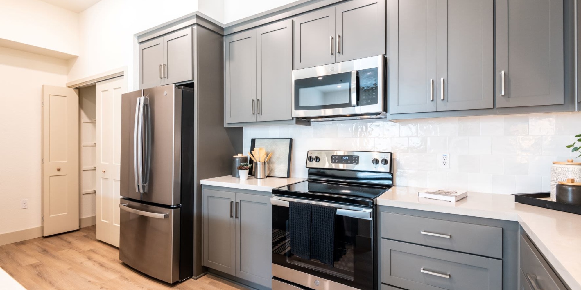 Kitchen with new appliances at Towne Centre Apartments in Lathrop, California