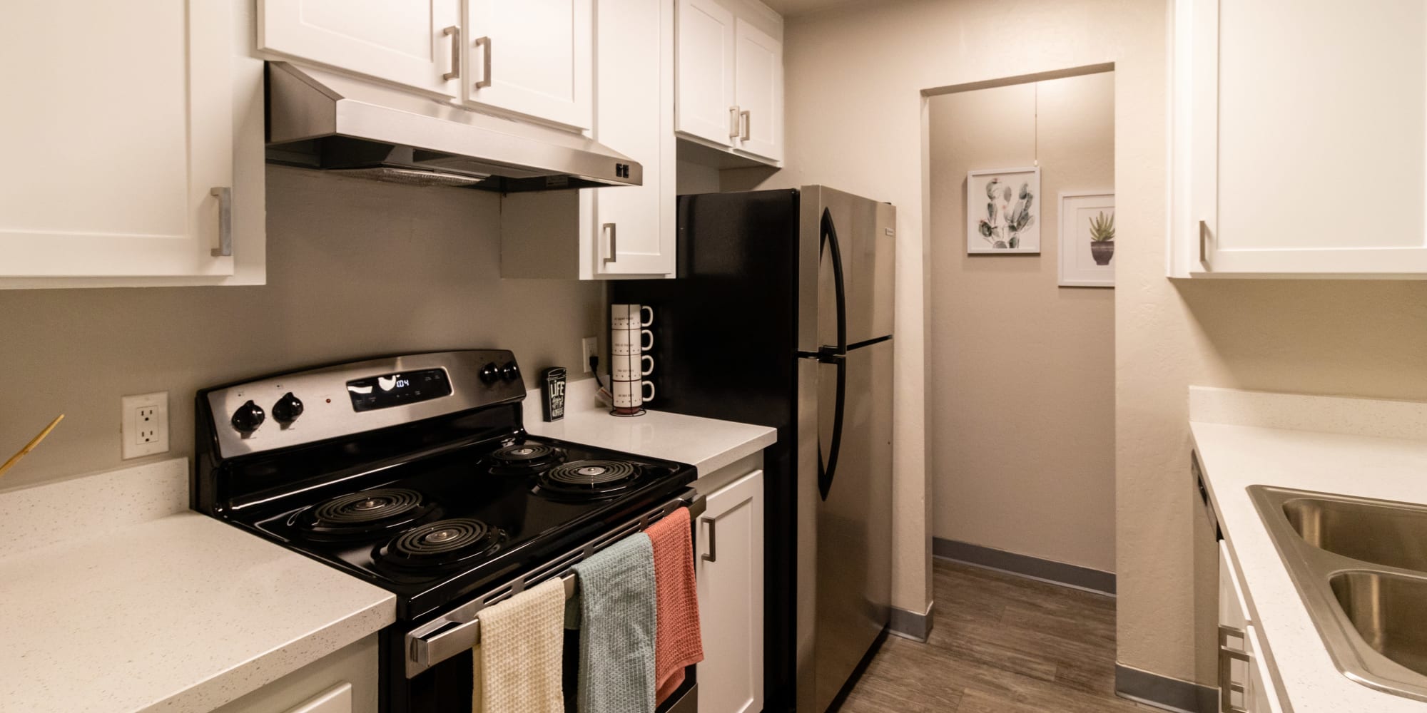Kitchen with stainless-steel appliances at Keyway Apartments in Sparks, Nevada