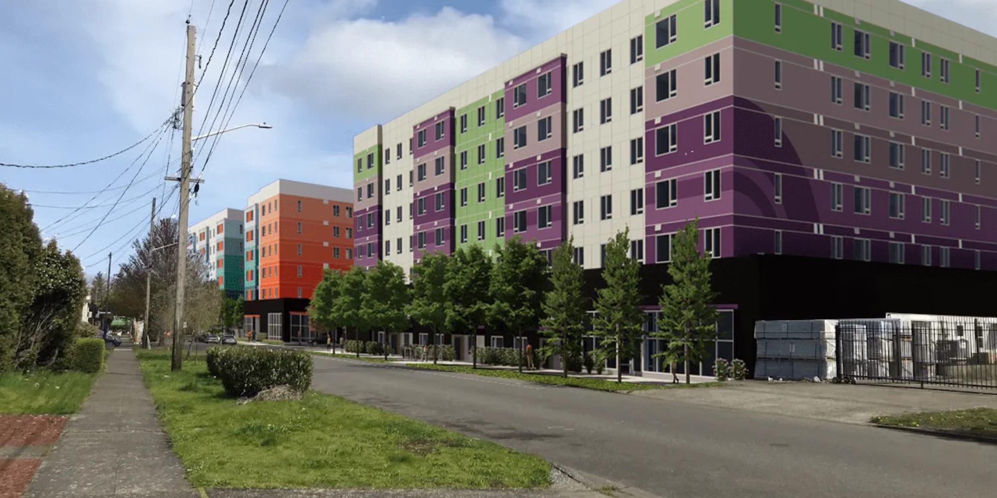 Exterior building with sidewalk at Housing Hilltop in Tacoma, Washington