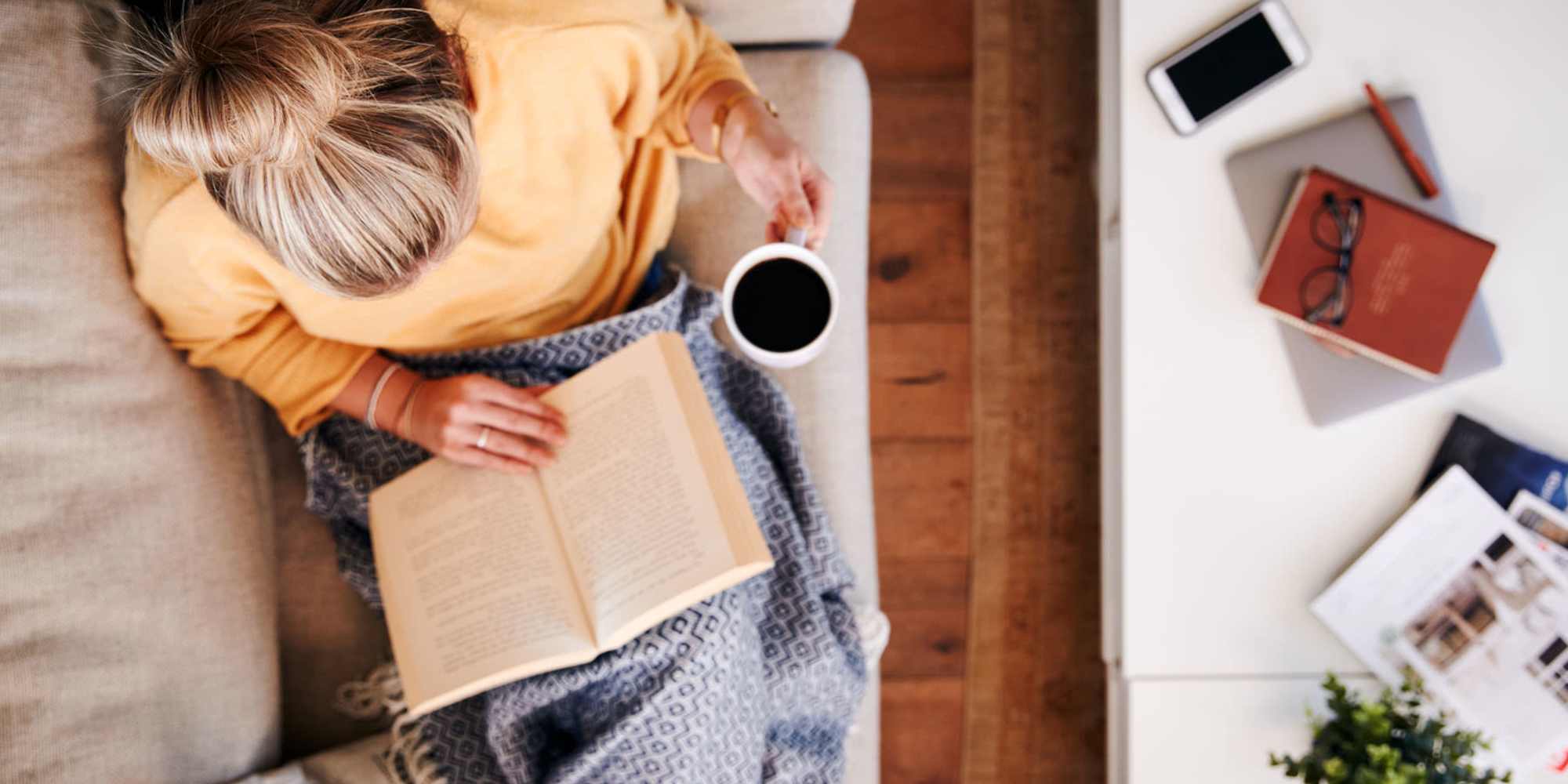 Resident reading at home at Magnolia Creek Apartments in Tulsa, Oklahoma