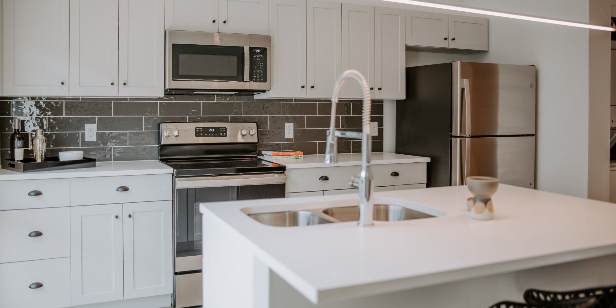 Modern model kitchen at Industry Columbus Apartments in Columbus, Ohio