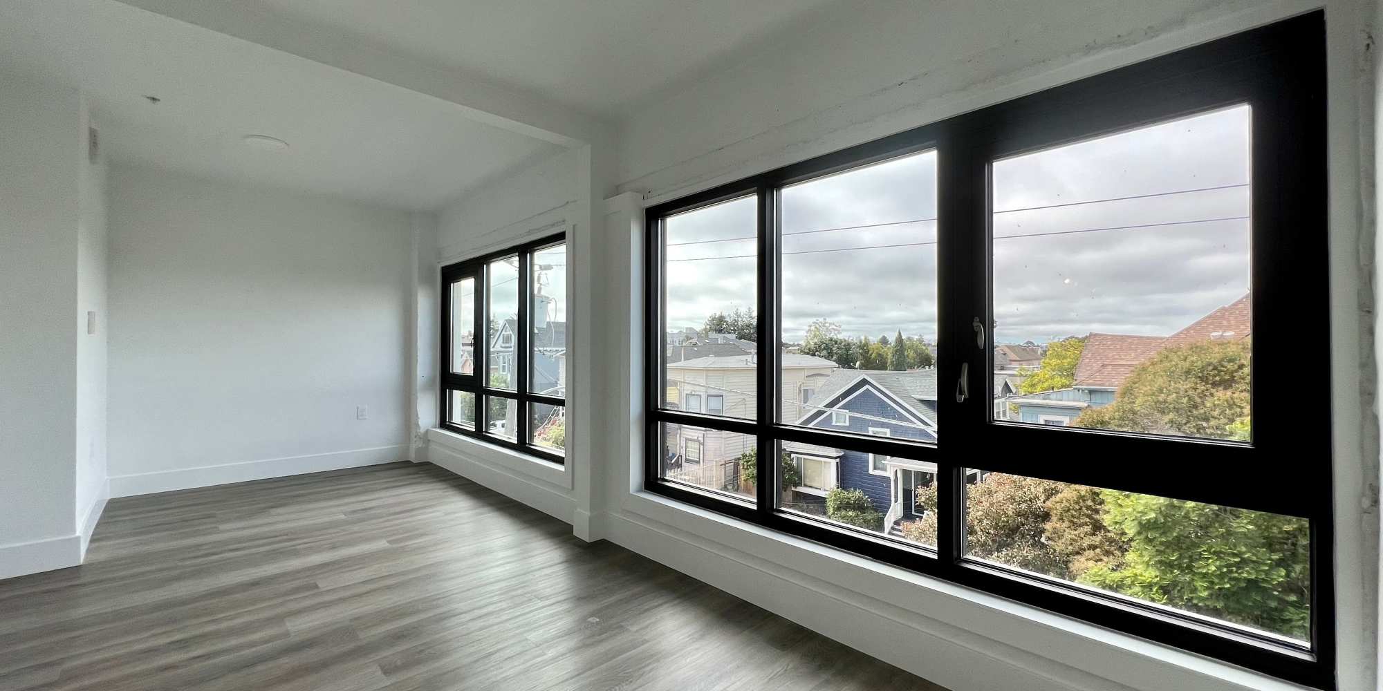 Large windows in an apartment at 1919 Market Street in Oakland, California