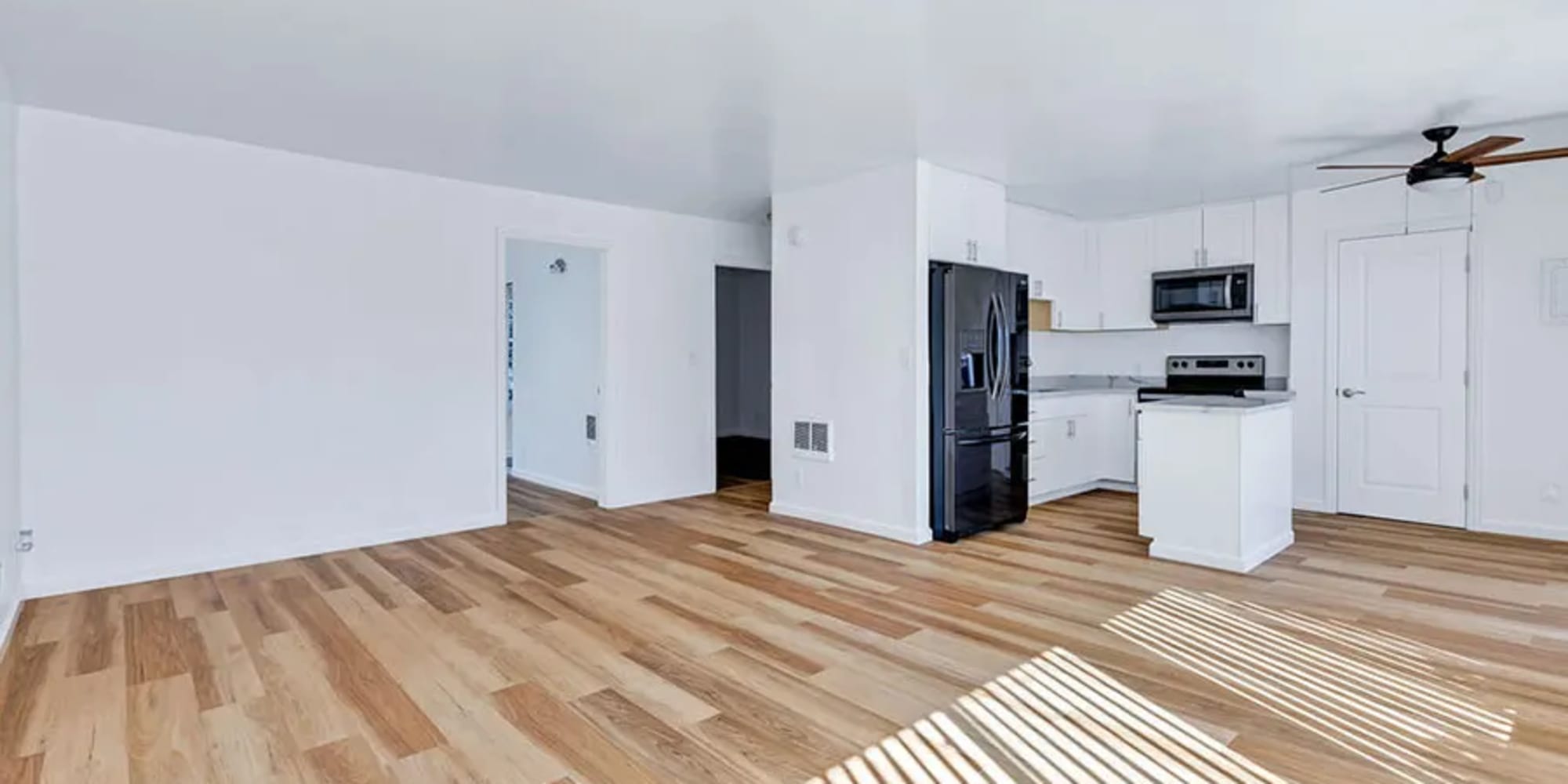 Wood flooring in an apartment kitchen, dining room and living room at Silverado Gardens in Napa, California