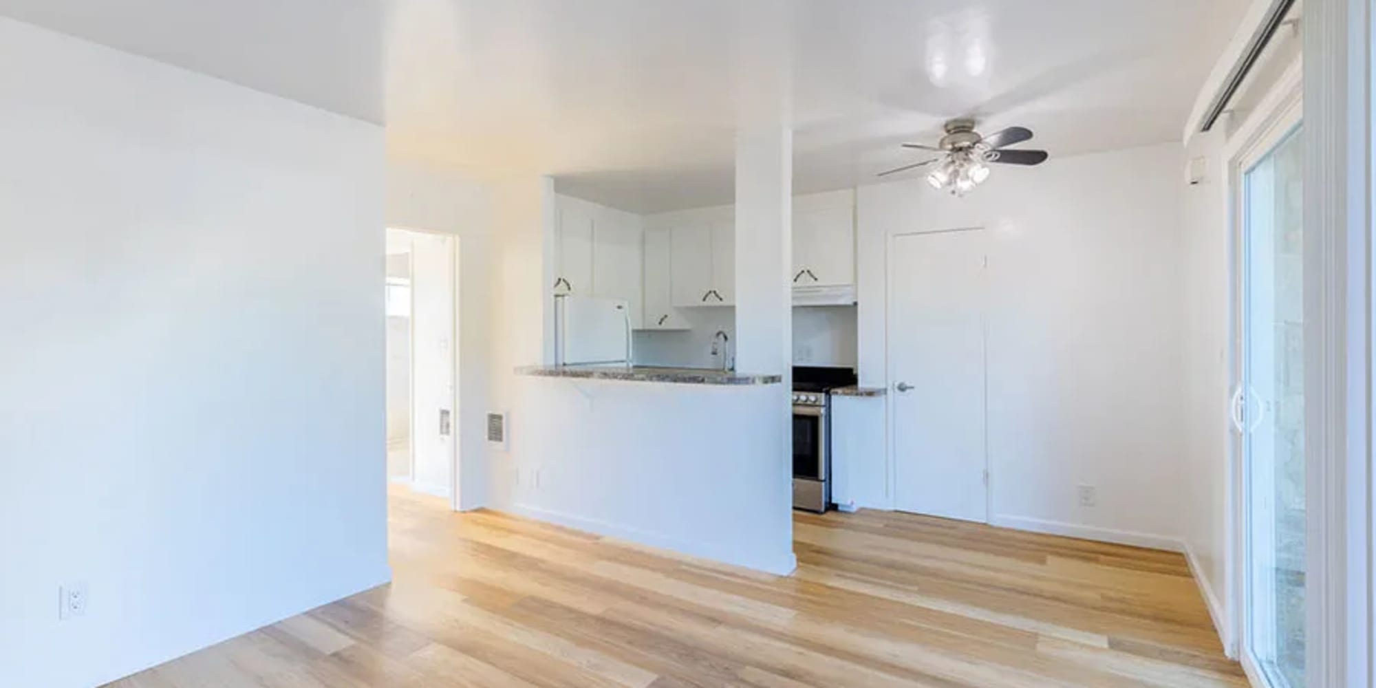 An apartment kitchen, dining room and living room at Silverado Gardens in Napa, California