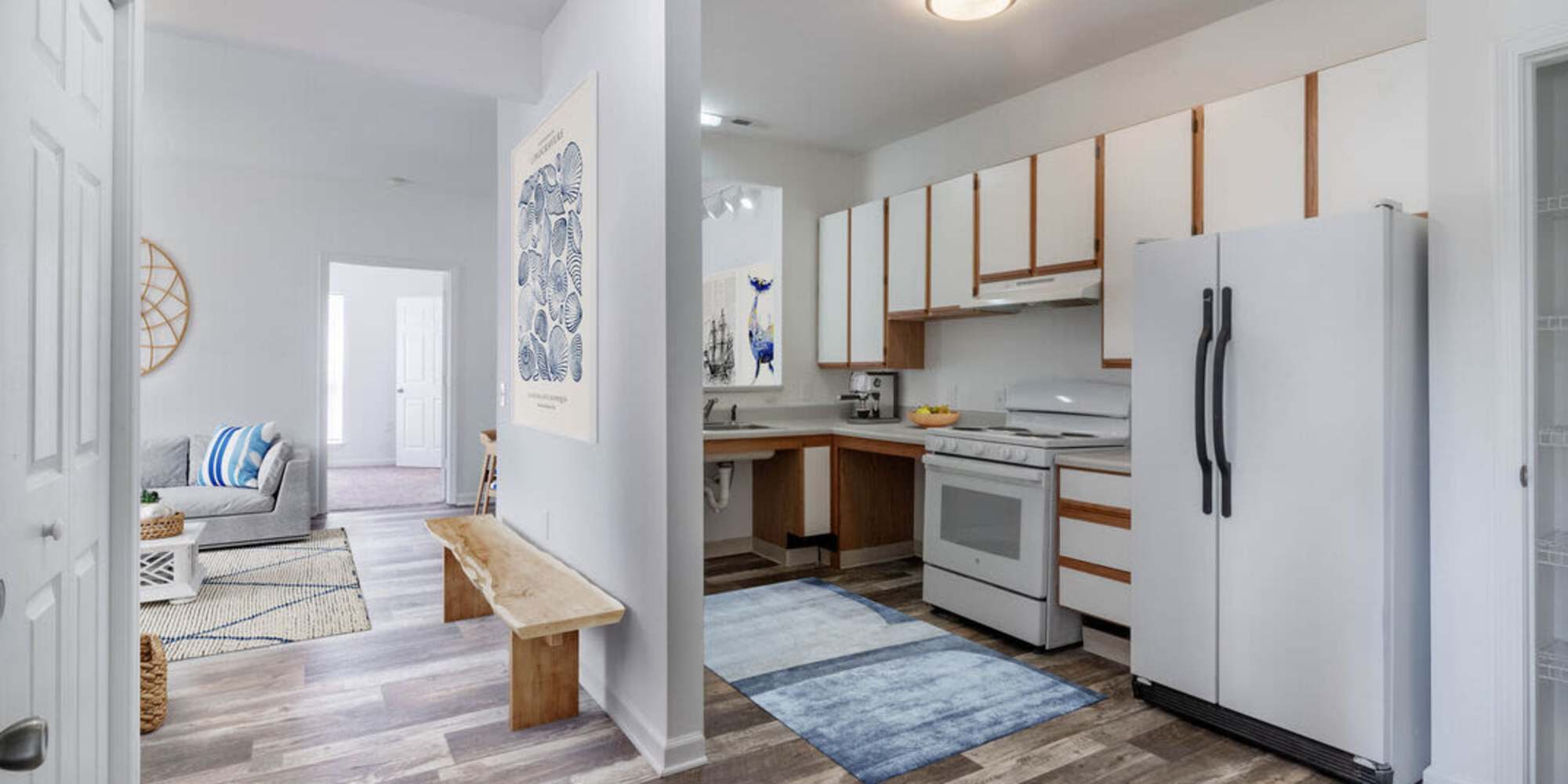 Living room and modern kitchen at Home at Sand Ridge in Wilmington, North Carolina