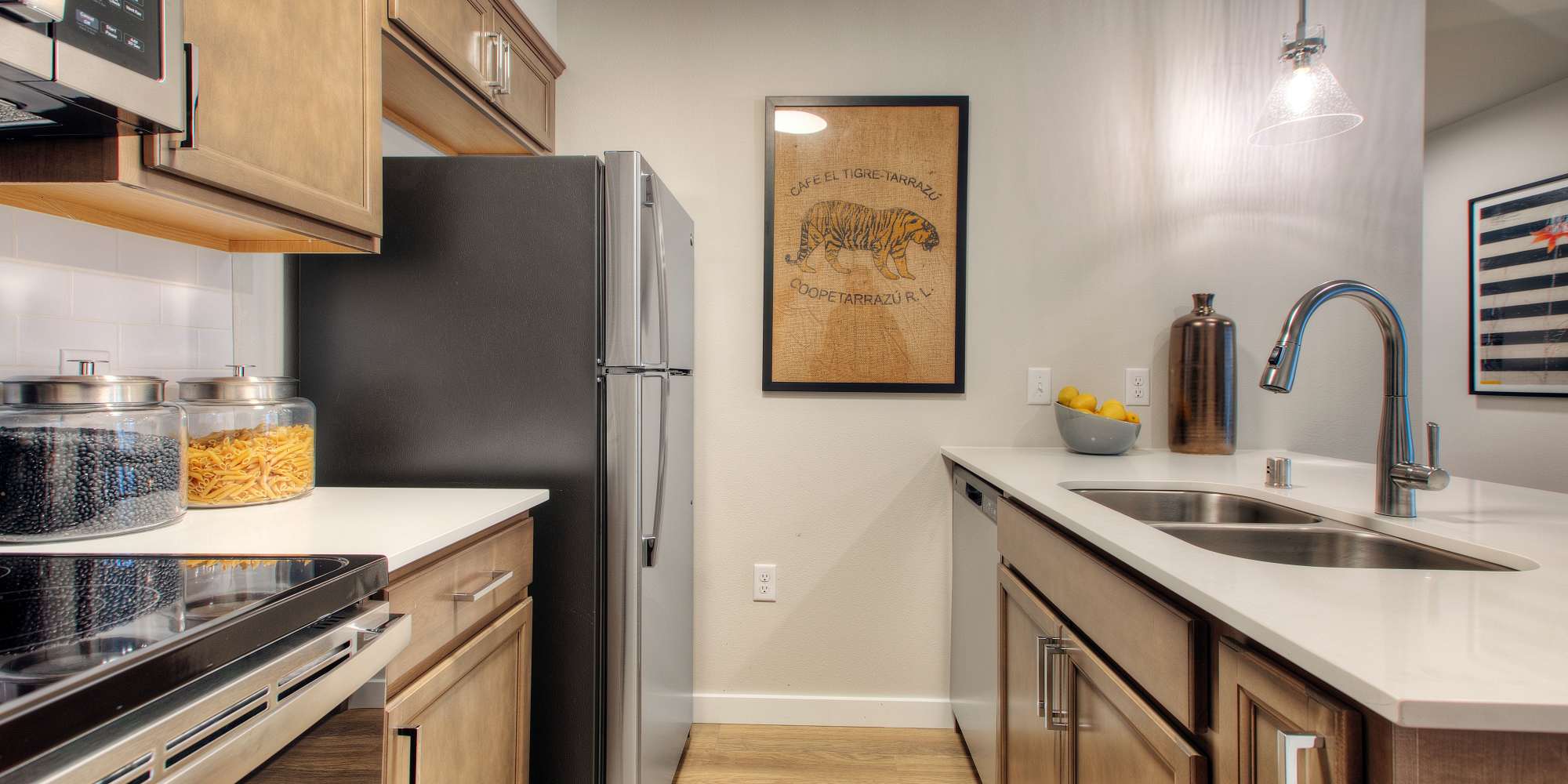 Kitchen with stainless-steel appliances at Alder Walk in Puyallup, Washington