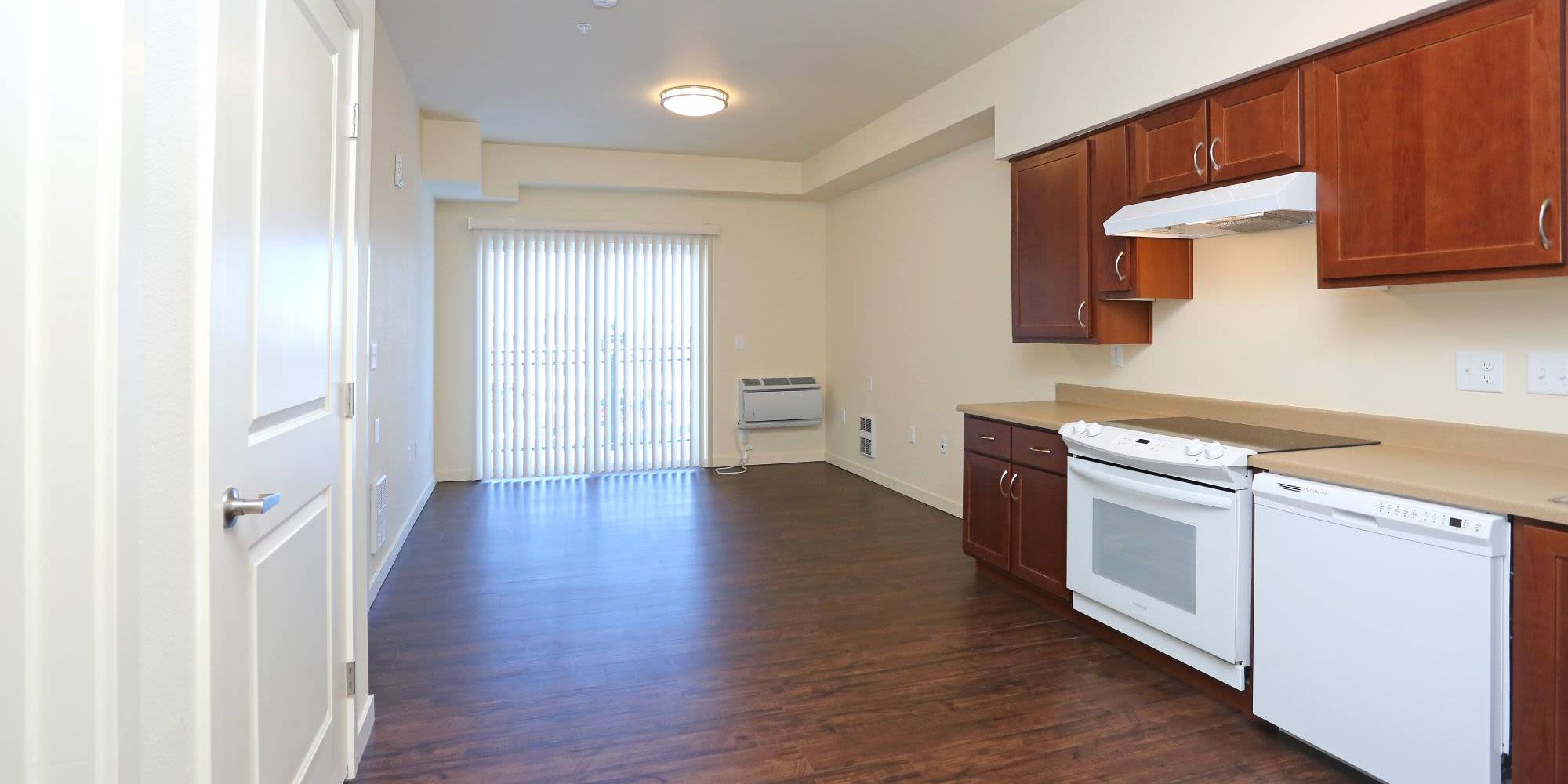 Model apartment with hardwood floors at Traditions at Colorado Springs in Colorado Springs, Colorado