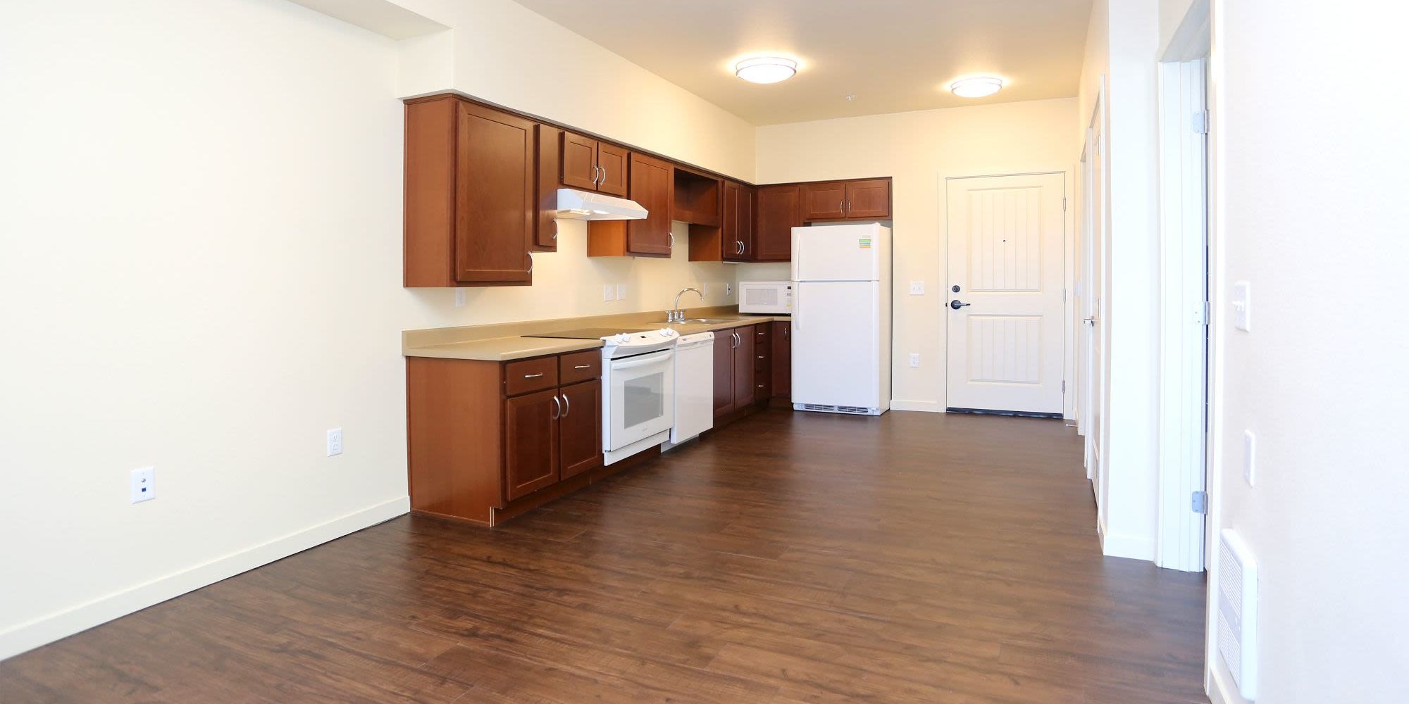  Model kitchen with hardwood floors at Traditions at Colorado Springs in Colorado Springs, Colorado