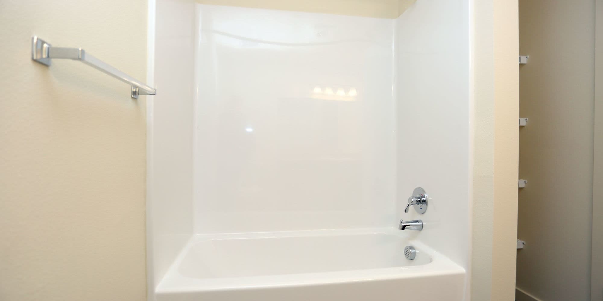 Bright bathroom with shower and tub at Traditions at Colorado Springs in Colorado Springs, Colorado