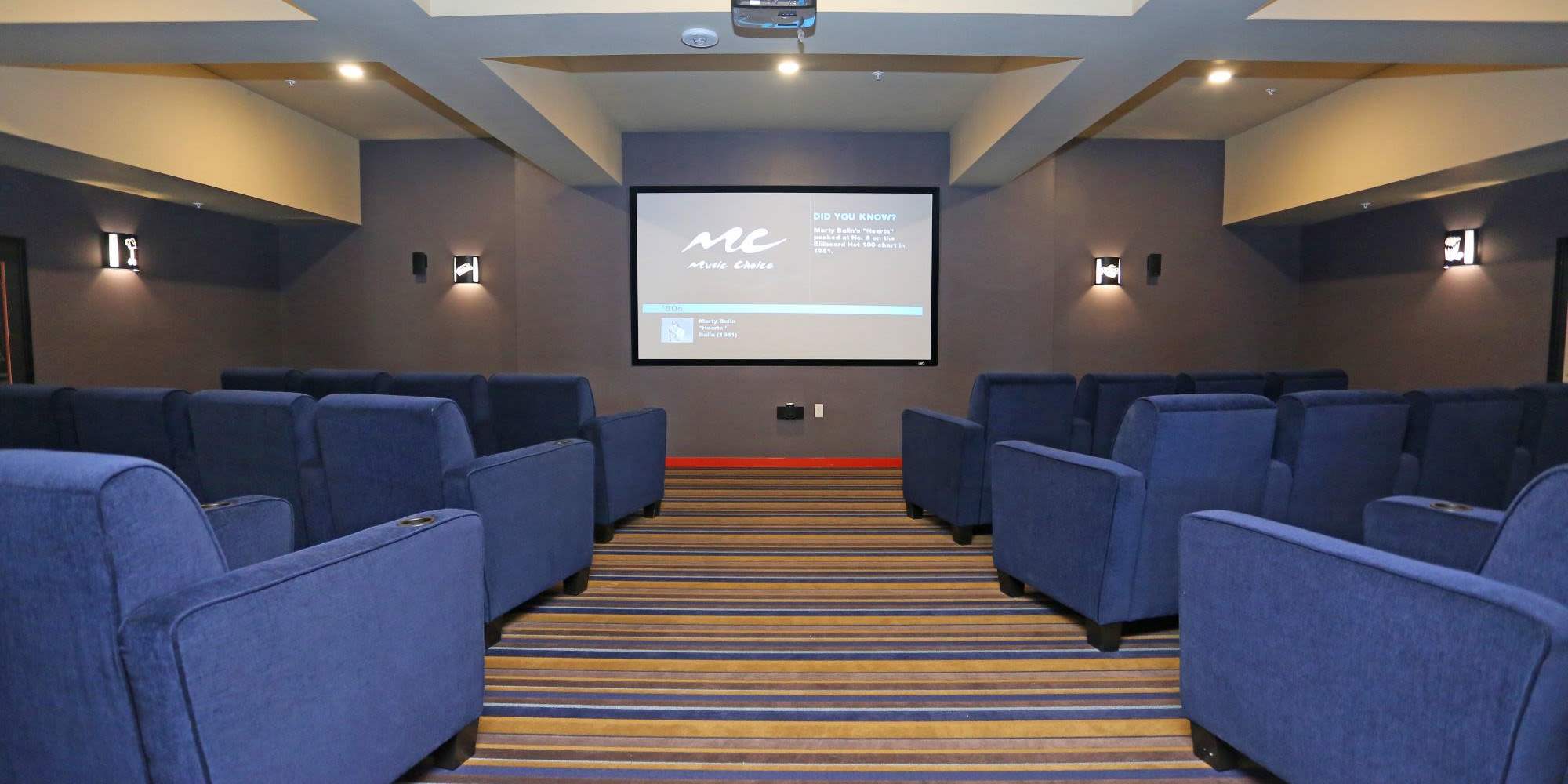 Movie theater with seats at Traditions at Colorado Springs in Colorado Springs, Colorado