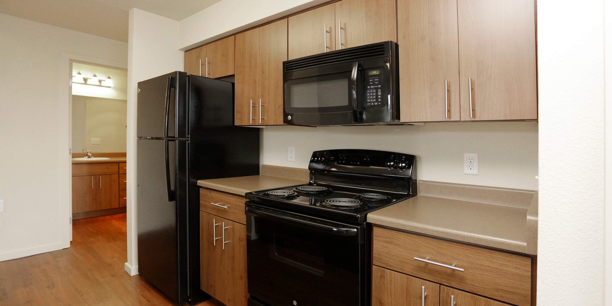 Kitchen with black appliances at Copper Creek in Colorado Springs, Colorado