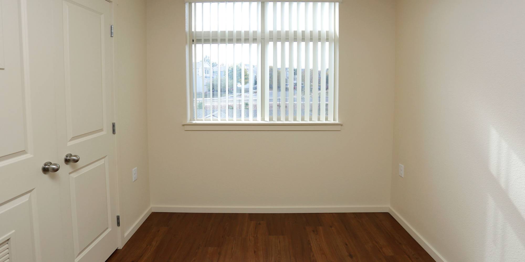 Bedroom with wood-style flooring at Copper Creek in Colorado Springs, Colorado