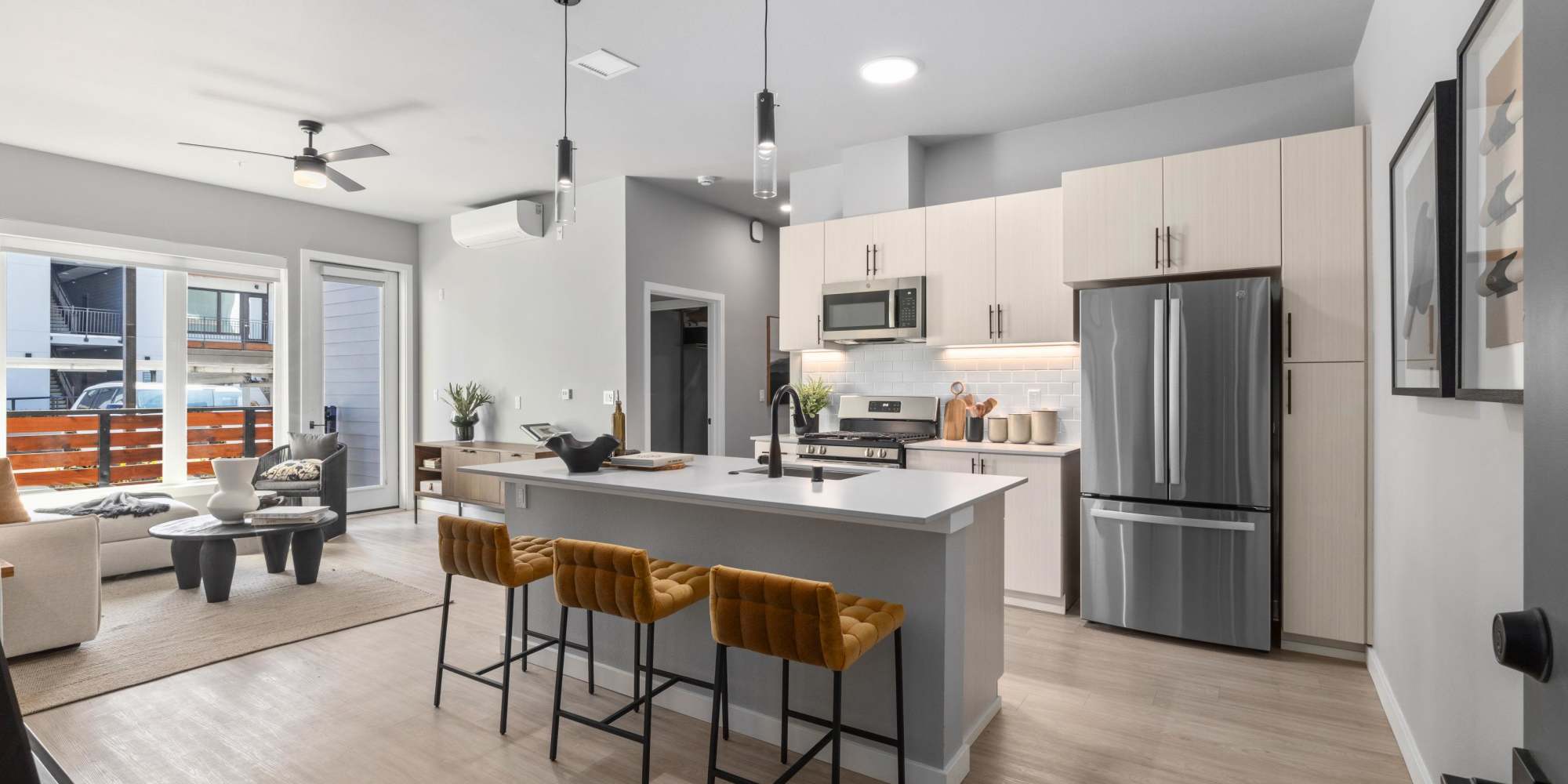 Spacious Gorgeous Kitchen with Island and View of Living Room at The Highlands at Silverdale in Silverdale, Washington