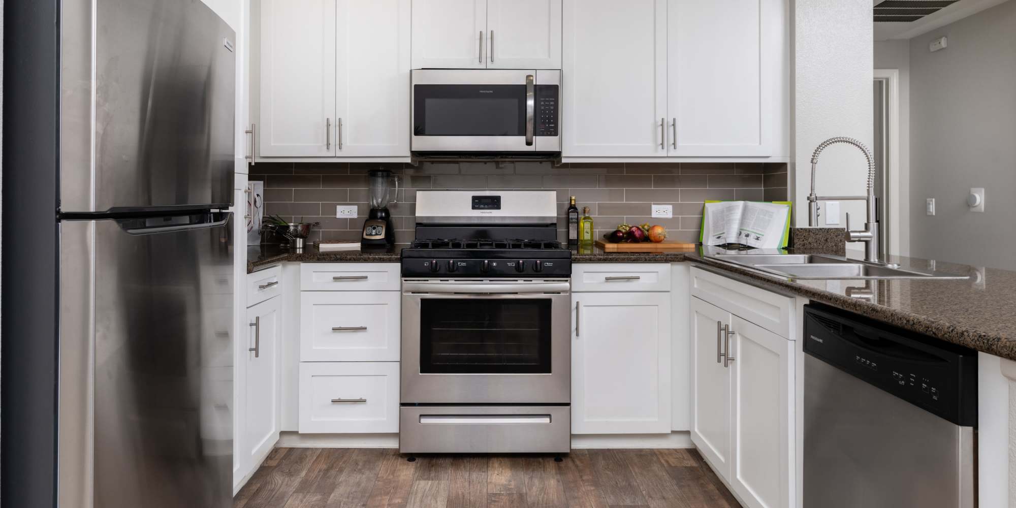 Kitchen with stainless-steel appliances at Paragon at Old Town in Monrovia, California