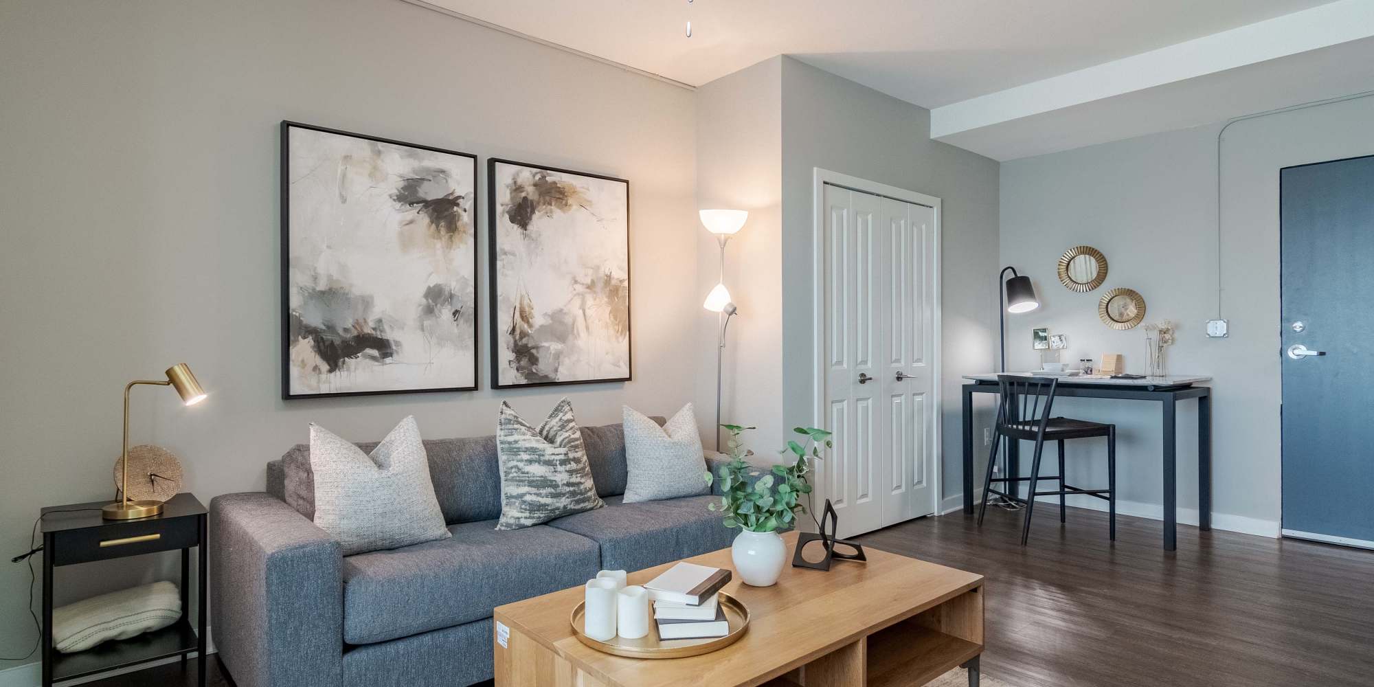 Model living room with furnishings at The Lofts at Twenty25 in Atlanta, Georgia