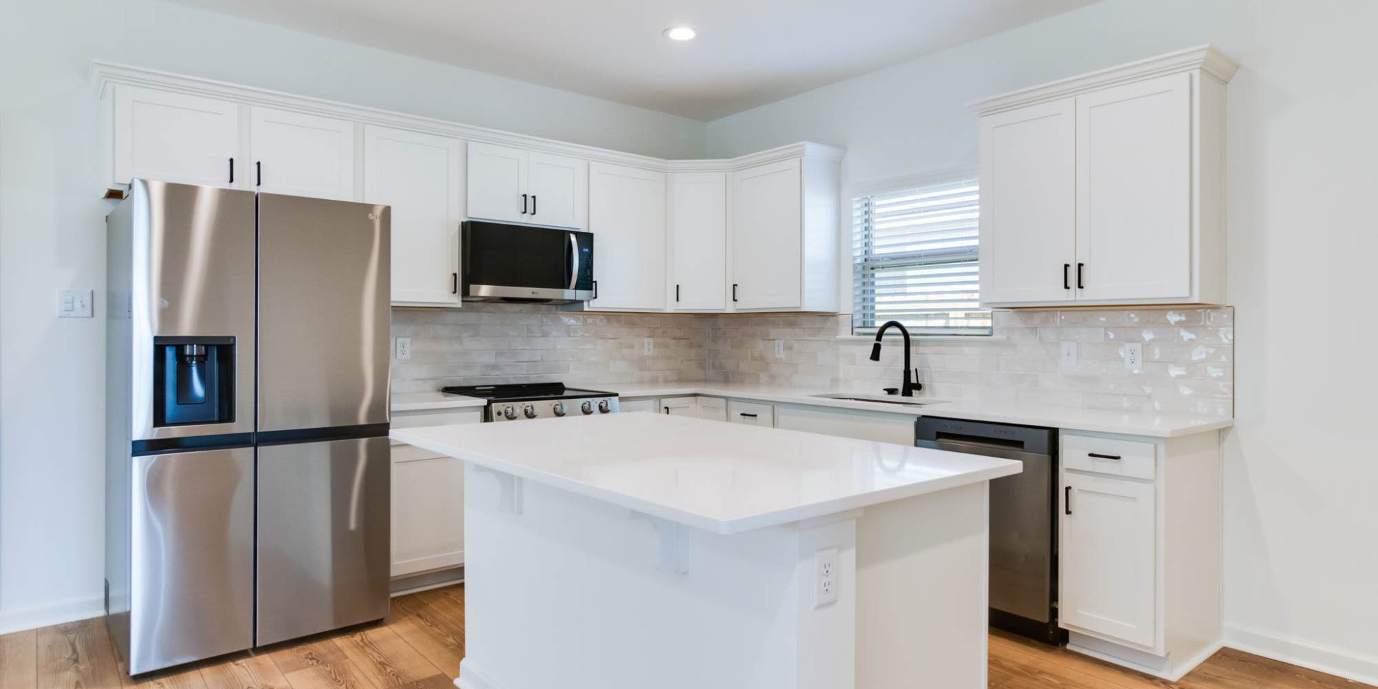 Spacious kitchen in a model home at Cottages at Sugar Mill Pond in Youngsville, Louisiana