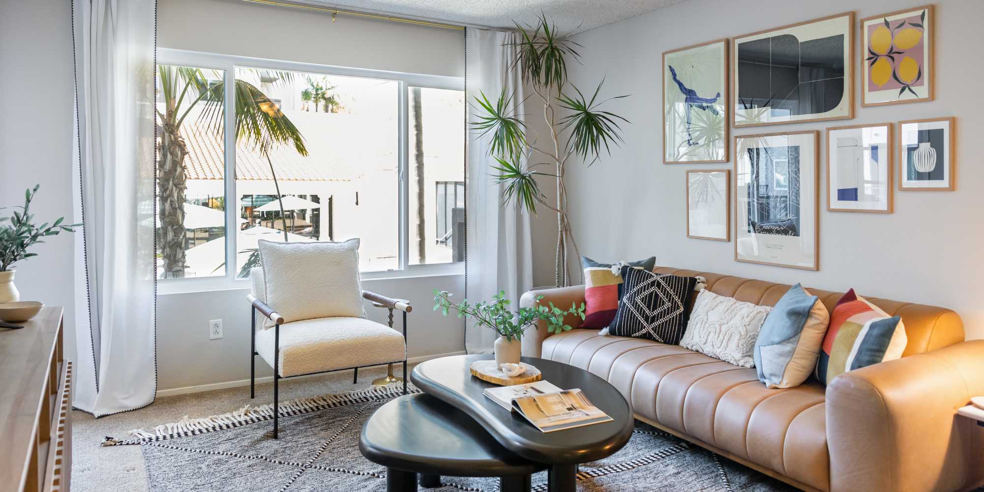 Cozy living room with a leather sofa at Veranda La Jolla in San Diego, California