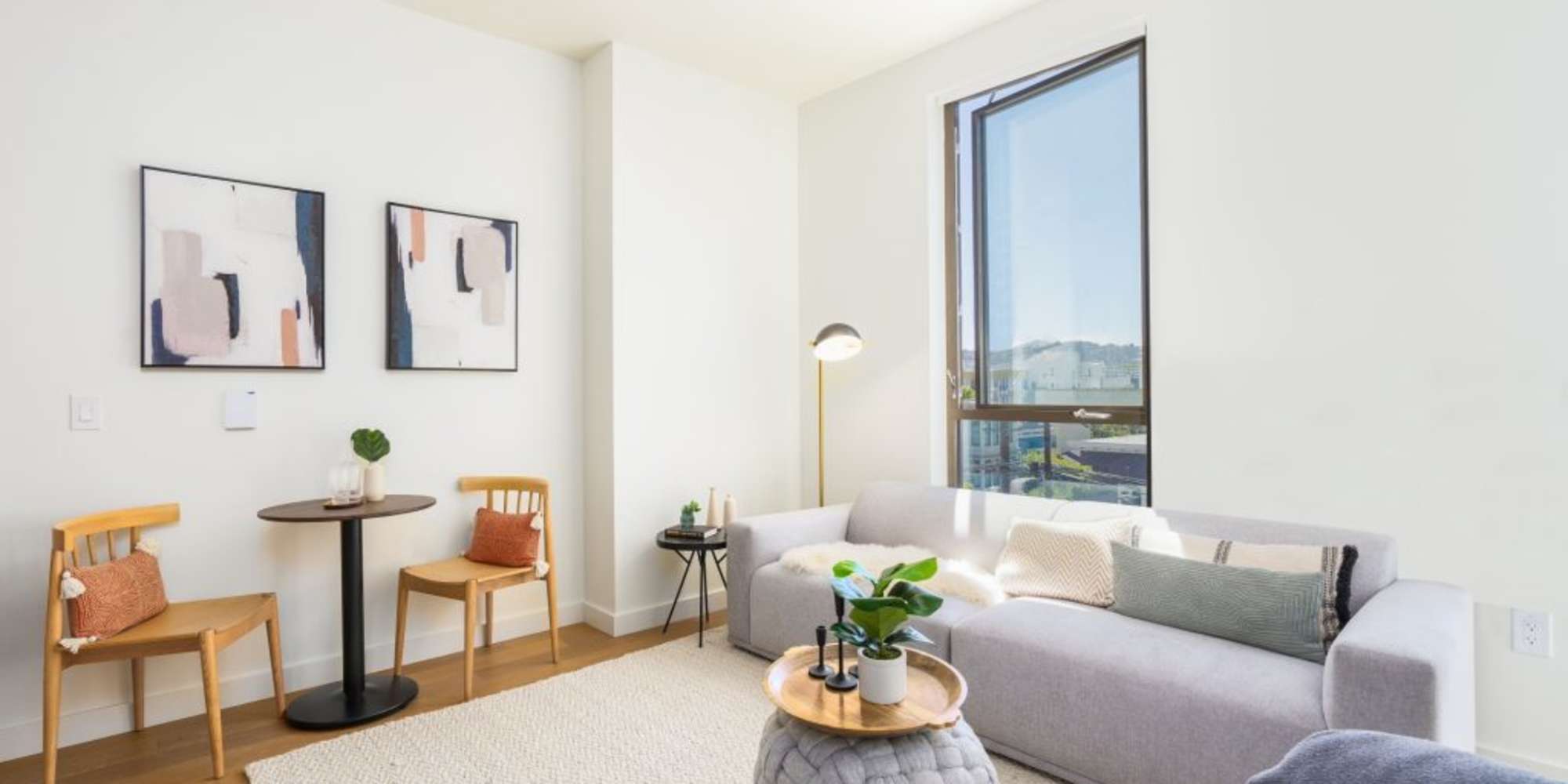 Living room with large window at The Fitzgerald in San Francisco, California