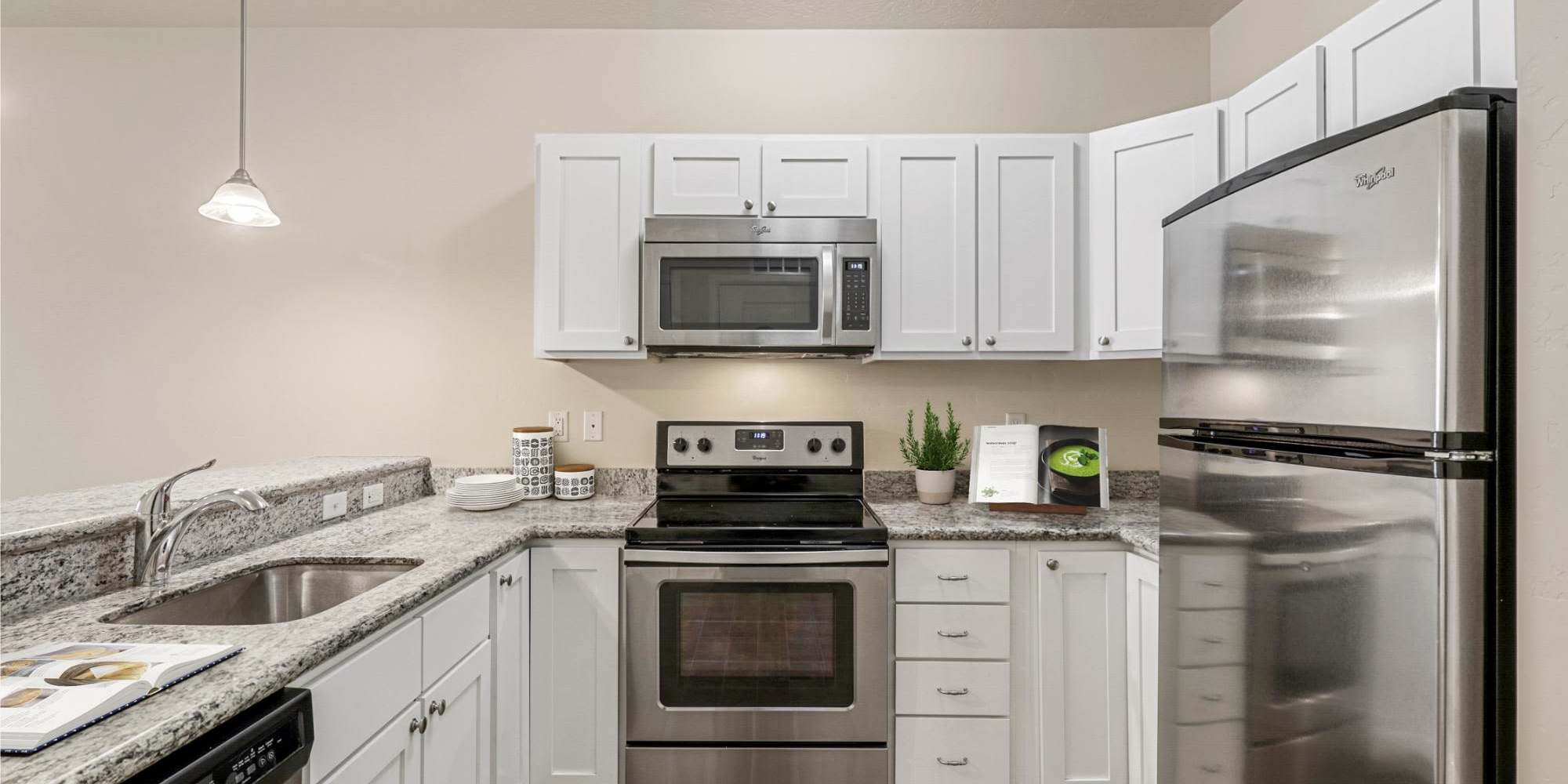 Kitchen with stainless steel appliance  at Sugar Flats in Salt Lake City, Utah 