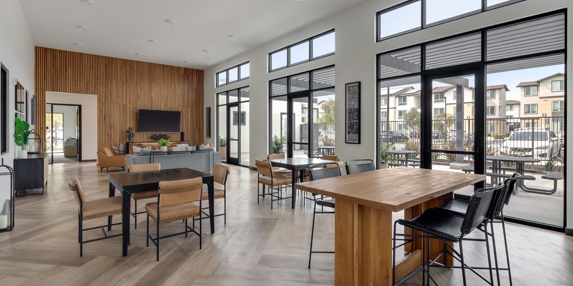 Resident clubhouse with lots of seating at Village at First in Gilroy, California
