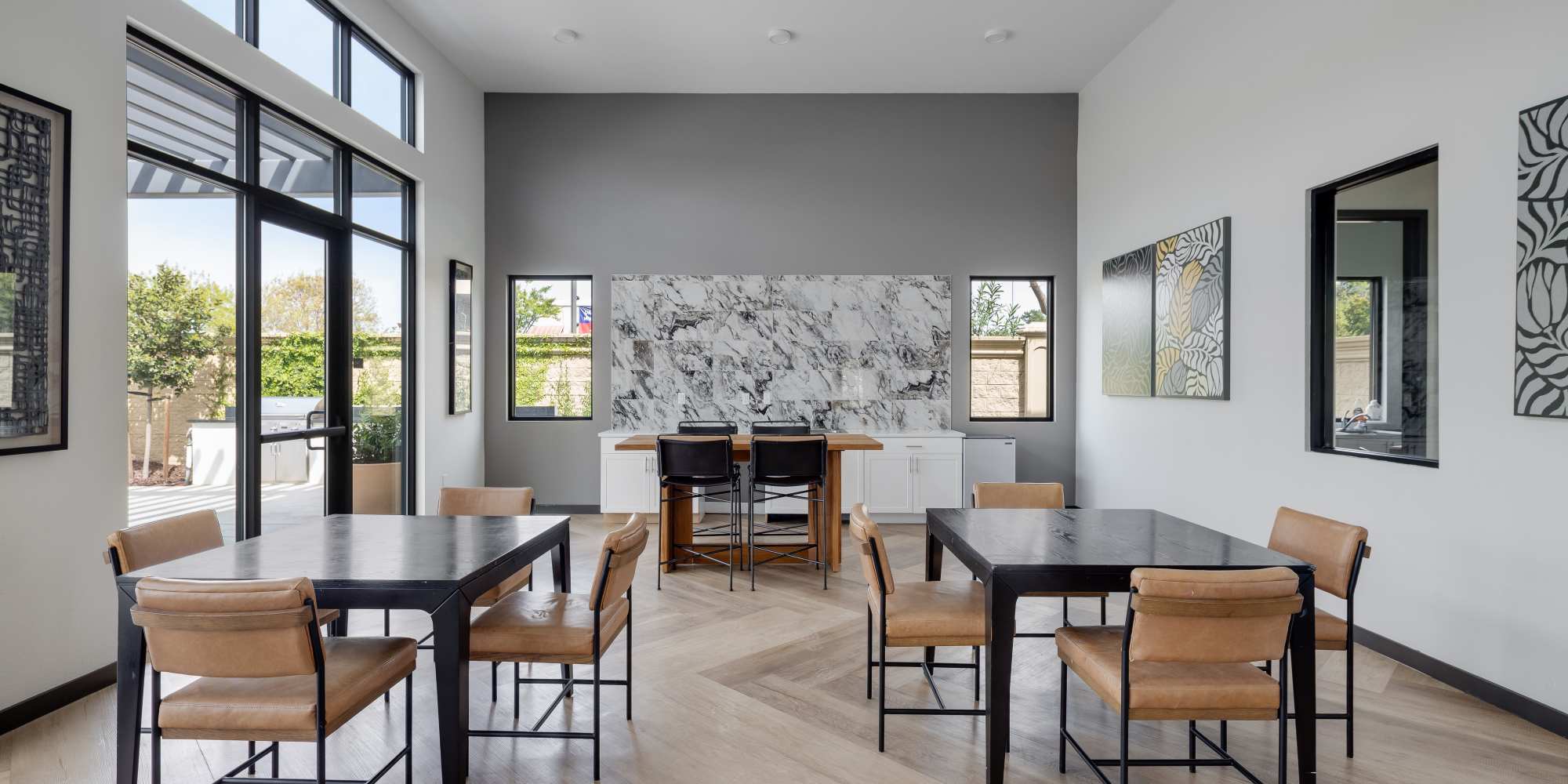 Meeting tables in the clubhouse at Village at First in Gilroy, California