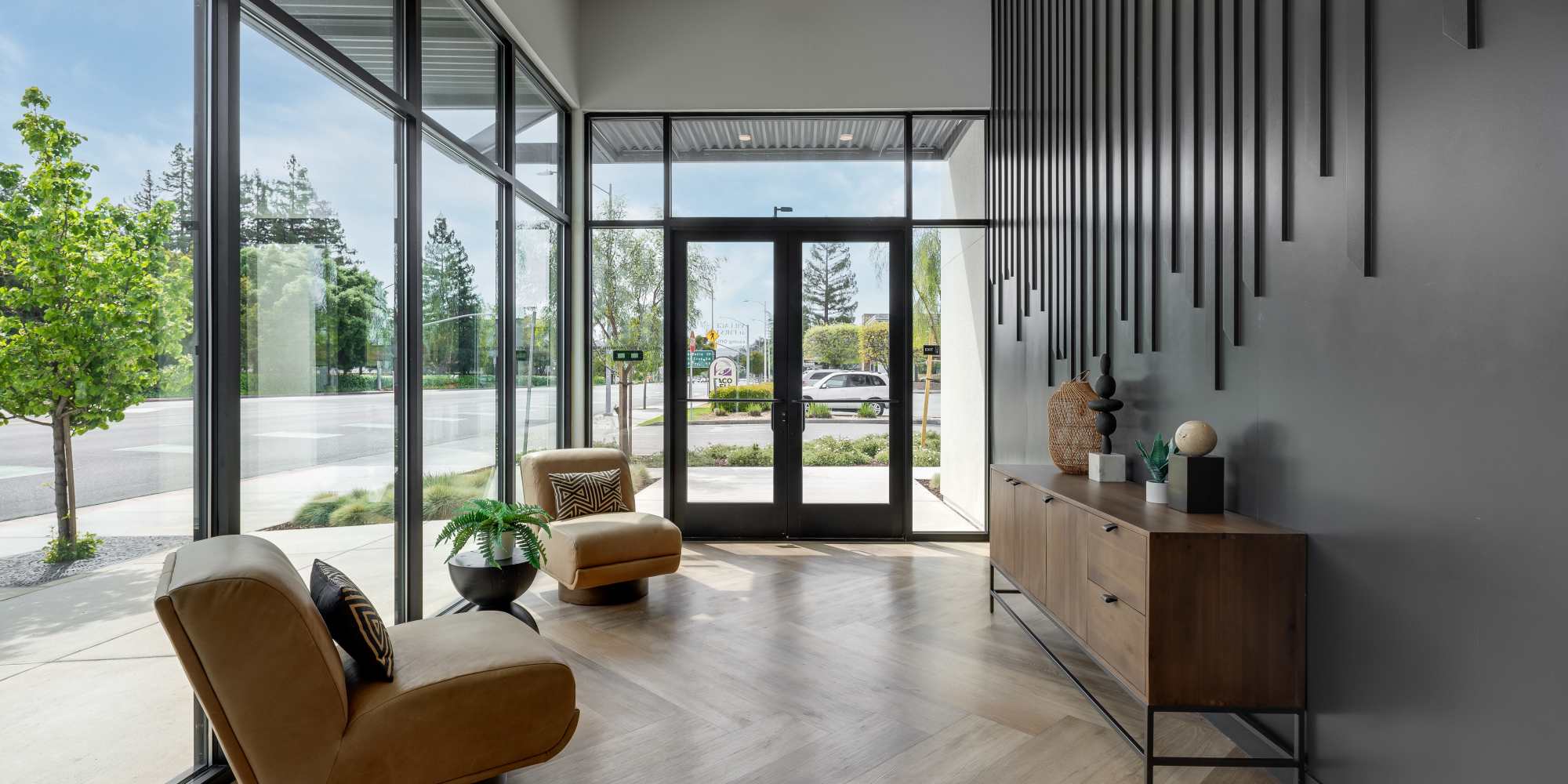 Large windows in the lobby area at Village at First in Gilroy, California
