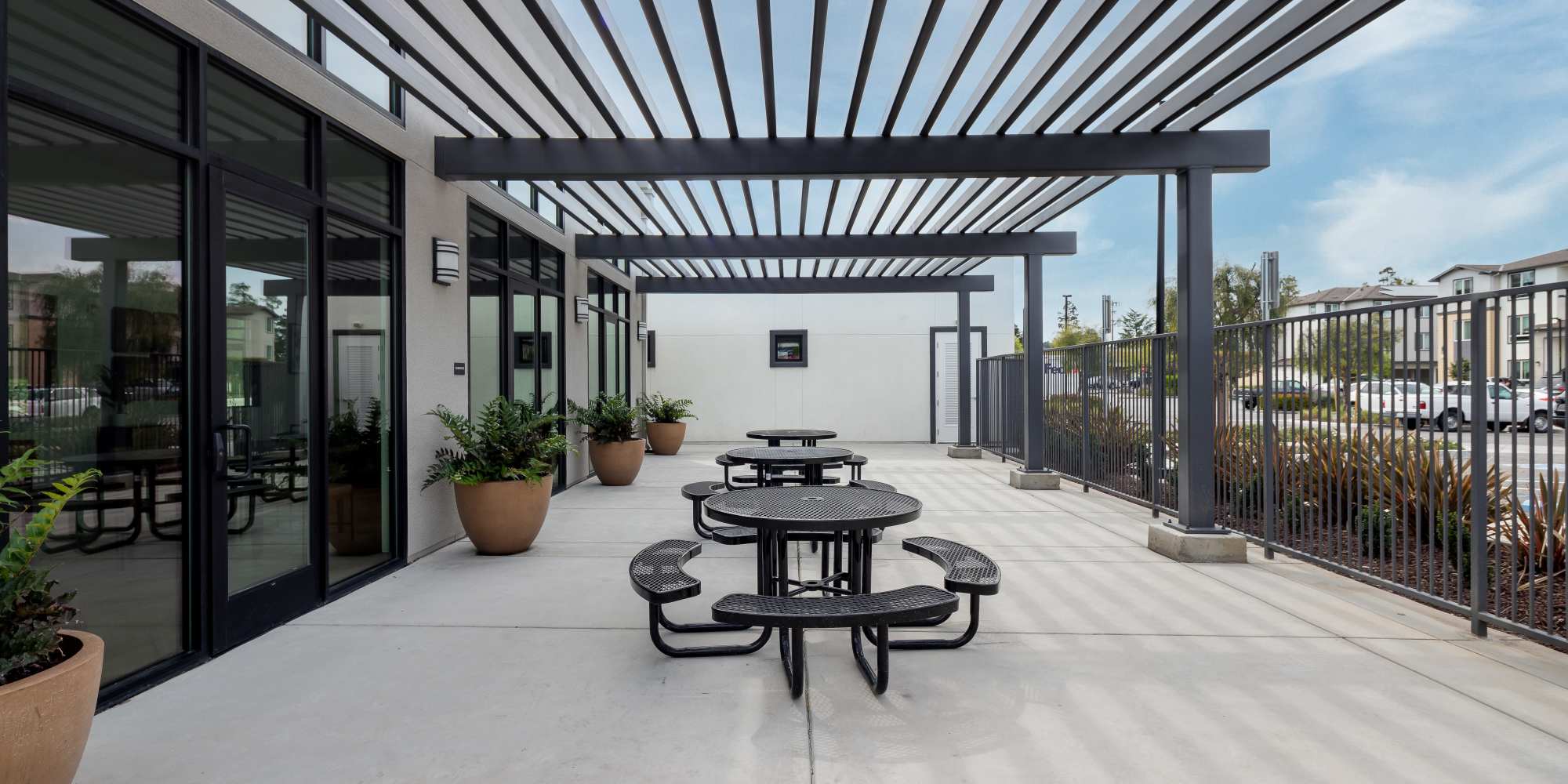 Outdoor picnic seating at Village at First in Gilroy, California