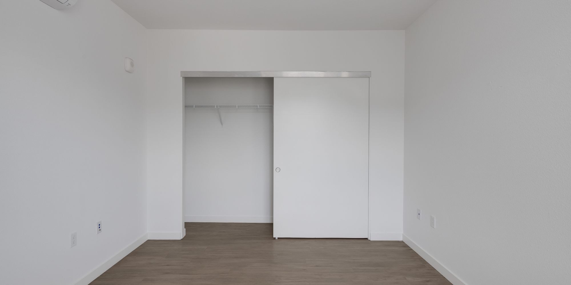 Bedroom with closet at Village at First in Gilroy, California