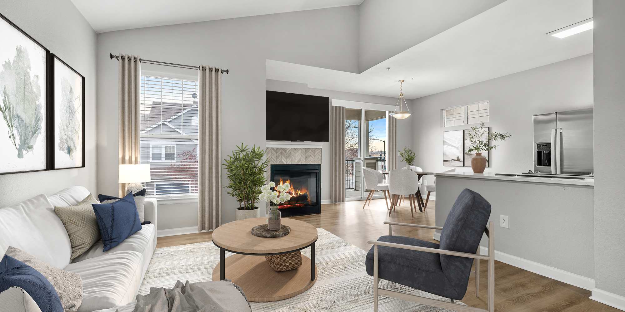 Newly Renovated Living Room With Hardwood Style Flooring and Fireplace at Briargate on Main in Parker, Colorado
