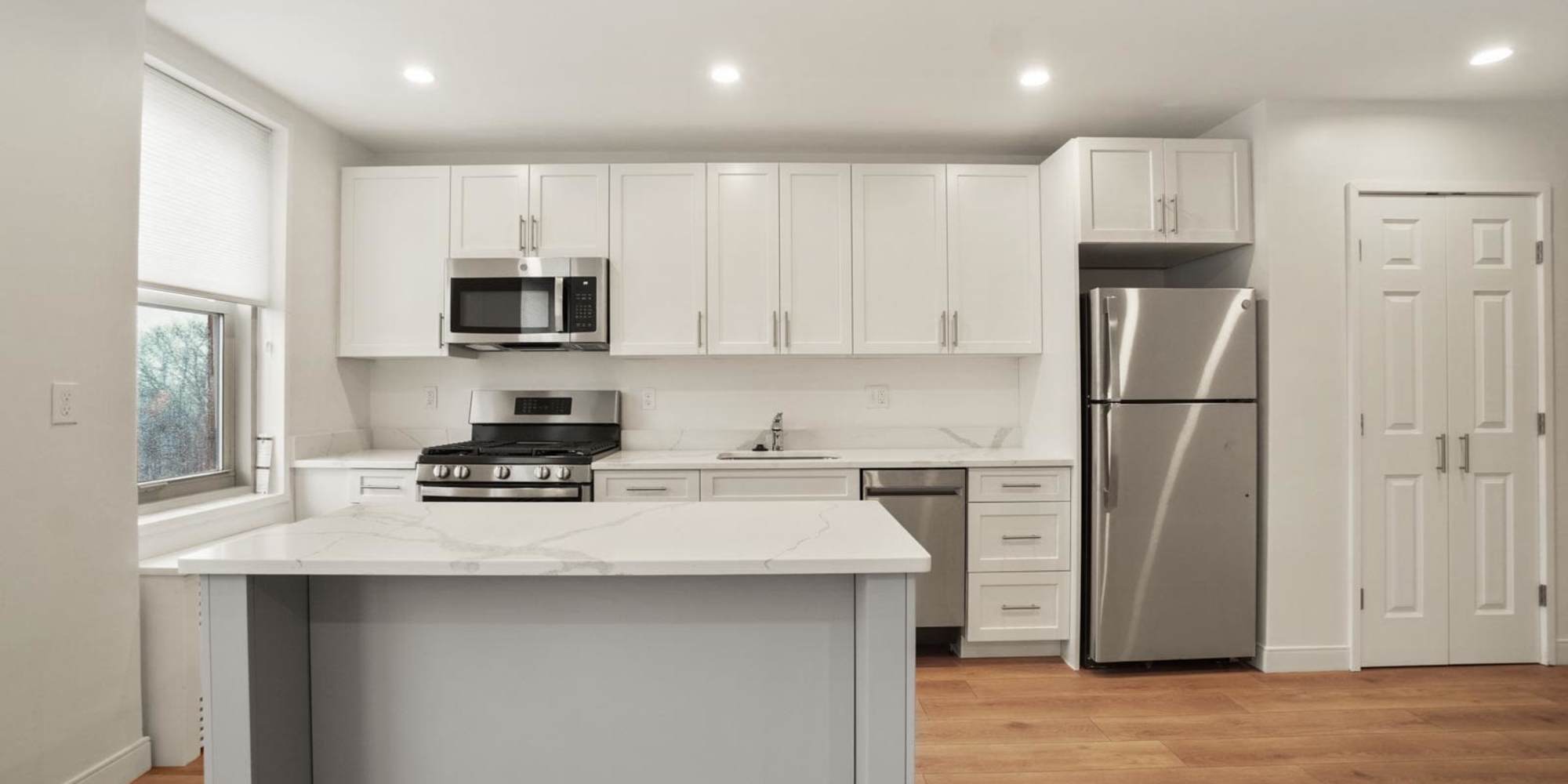 Beautiful kitchen with stainless-steel appliances at Camelot Court in Brighton, Massachusetts