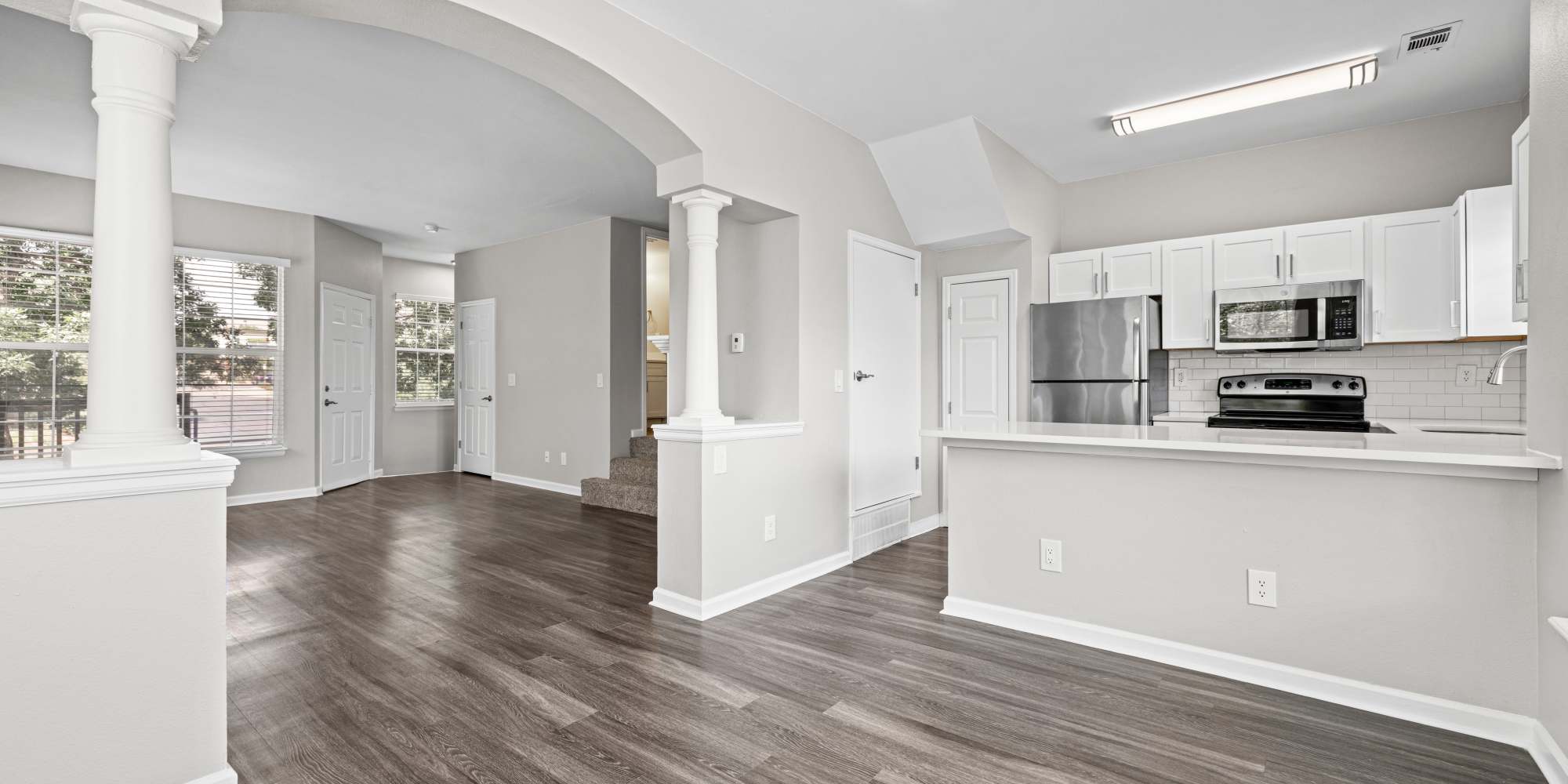 Newly renovated Kitchen and living room at Greenwood Village, Colorado, apartments at Isabella Apartment Homes